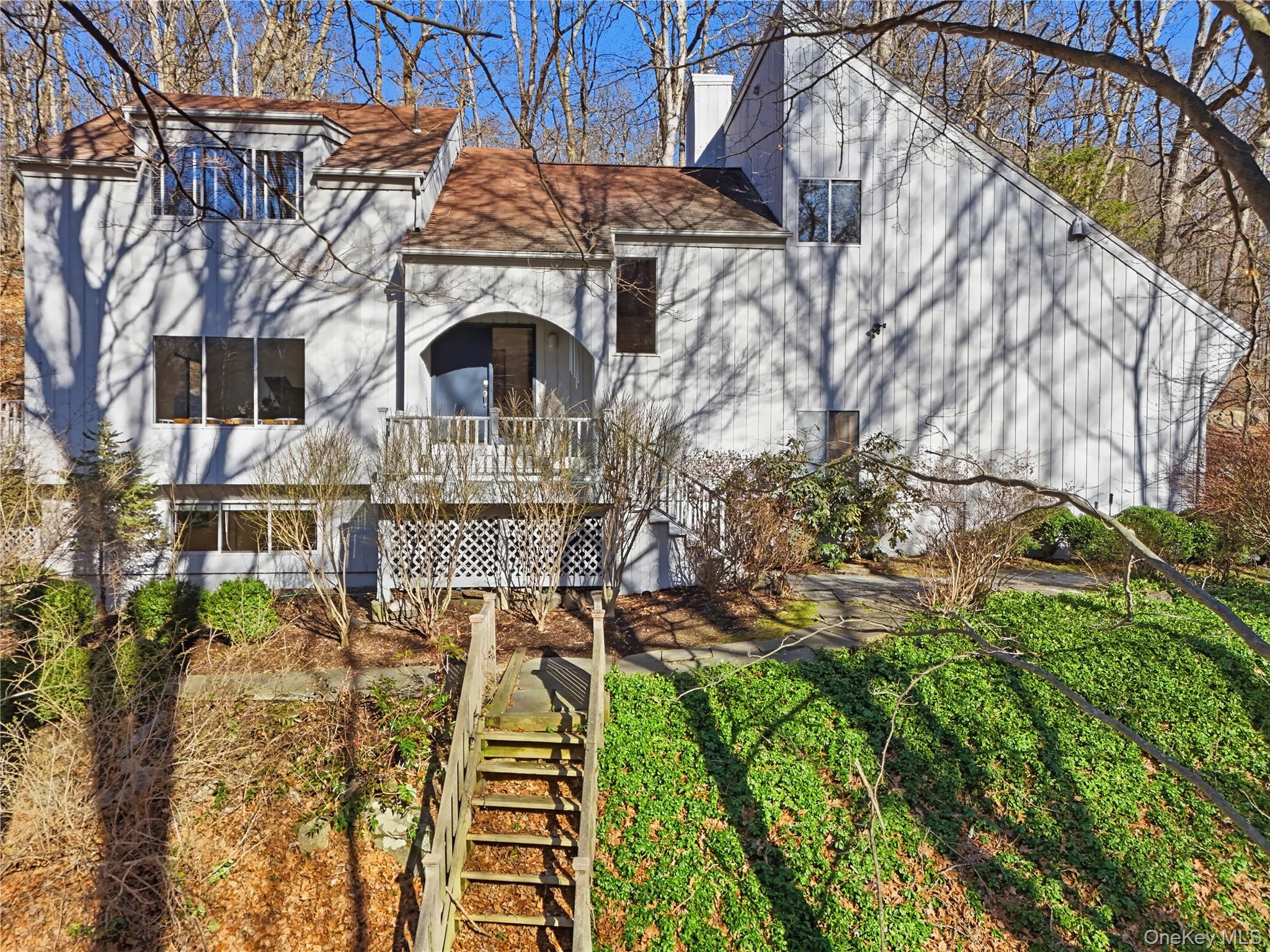 Tastefully updated and well maintained, this sophisticated yet traditional Contemporary home offers the perfect balance of elegance and comfort in the highly sought-after Chappaqua school district. The light-filled, open floor plan welcomes you with spacious rooms, soaring ceilings, and a floor-to-ceiling stone fireplace anchoring the dramatic great room. The expansive eat-in kitchen is a chef’s delight, featuring SubZero and Thermador stainless appliances, granite counters, and sliders that open to a wraparound IPE deck, ideal for seamless indoor-outdoor living and entertaining. Enjoy the outdoor stone grill and take in the tranquil natural surroundings that define this special property. Beautiful Brazilian cherry floors and thoughtful architectural details highlight the home’s craftsmanship. The second level of the home has four big bedrooms, two full baths (one en-suite) and a large walk-in cedar closet. The expansive walkout lower level has a large playroom, office, full bath and huge storage area. Situated on a private cul-de-sac, this residence blends the serenity of a bucolic, wooded setting with the convenience of a neighborhood location close to schools, town, and train. Freshly painted inside and out in 2026, with underground utilities and above-ground oil tank, this turn-key home is ready to move in and enjoy. A wonderful Chappaqua offering—private, refined, and welcoming.