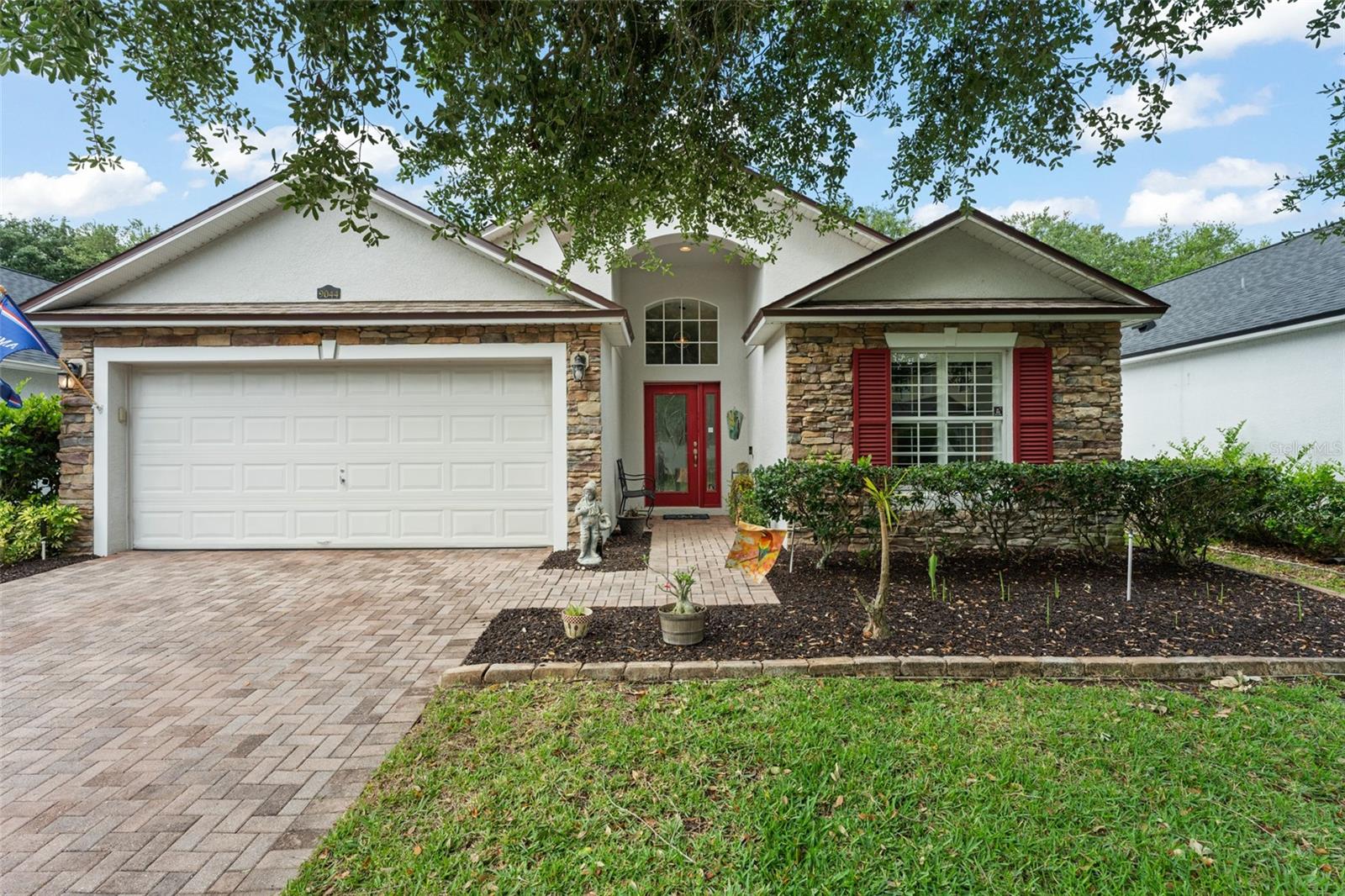Welcome home to this beautifully maintained, move-in ready 3-bedroom, 2-bath residence located in the desirable Enclave at Moss Park, just minutes from Lake Nona. Thoughtfully designed with an open-concept layout and split-bedroom floor plan, this home offers both functionality and privacy—perfect for everyday living. From the moment you enter, you’re greeted by soaring vaulted ceilings and an abundance of natural light, creating a bright and inviting atmosphere throughout. The updated kitchen features newer granite countertops, stainless steel appliances, and ample prep space, seamlessly connecting to the main living areas for easy entertaining. Both bathrooms have been tastefully updated, adding to the home’s clean and modern feel. Additional highlights include plantation shutters, newer roof (2022) and a whole-home water filtration system, offering added peace of mind and enhanced quality of living. The home has been exceptionally well cared for and shows beautifully inside and out. Step outside to a fully fenced backyard, providing privacy and versatility—ideal for entertaining, pets, or simply relaxing in your own outdoor space. Residents of the Enclave at Moss Park enjoy access to a range of amenities including a community pool with cabana, playground, basketball court, picnic areas, and open green spaces.Ideally situated just minutes from Lake Nona Medical City, Orlando International Airport, top-rated schools, shopping, dining, and major roadways, this home combines comfort, convenience, and location. A perfect opportunity to own in one of Central Florida’s most sought-after areas.