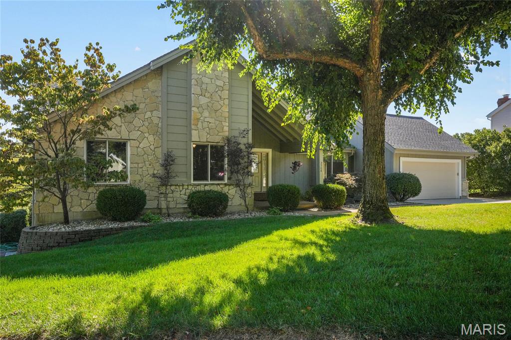 Welcome home to 4000 sq. ft. of luxurious living space.  This stunning 5 bed/3 bath atrium ranch sits on a quiet cul-de-sac in the Rockwood School District and backs to a pond.  This home is updated and meticulously maintained, including a new roof in 2026.  When you walk in, you are greeted by gorgeous hardwood floors, a cathedral ceiling, and a wall of upgraded shatter-proof atrium windows.  The main floor features a primary bedroom suite with a magnificent updated spa-like bathroom with a remote-controlled skylight.  There are also two other bedrooms and a formal dining area.  The kitchen has solid-surface counters, stainless appliances, and access to a beautiful composite deck, which leads to a custom stamped-concrete patio.  You’ll never want to leave home, and you won’t have to because this home is perfect for entertaining.  The lower living area has a full wet bar and entertaining area.  There are also two additional bedrooms and a huge spare room, ideal for an office or a crafting/hobby area.