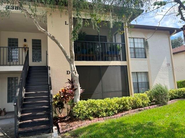 You will feel at home from the moment you enter the community. The 1st floor 2 bedroom/1 bath has been tastefully updated throughout. The flooring was updated late 2024 with water proof wood-like vinyl planks which run through the main living area and kitchen. Kitchen has newer granite counter tops,subway tile backsplash and stainless steel appliances including a brand new dishwasher that was put in a few weeks ago and a new microwave that is just a few months old. There is an indoor walk-in laundry closet with a new (2026) full size washer along with a dryer and a pantry shelf's. Both bedrooms are spacious and each have their own walk in closet for plenty of storage. The bathroom has newer tile flooring and a tub/shower combo. This unit also offers a private screened lanai that has been updated with pavers. Screened lanai also offers a personal storage closet. The AC is 2022 and hot water heater 2020. Water, Sewer and Trash are included in monthly HOA dues. Crystal Lake is an all age community and walking distance to East Lake YMCA which has pickle ball, tennis, heated pool with lap lanes, exercise classes and a big exercise room with weights, tread mill, and much much more.Crystal Lake is also right here. Great for walking around for exercise or just walking to see and meet the neighbors exercising there dogs or just sitting on a bench and watching the different Florida birds.John Chestnut park is only 6 miles away. East Lake Publix is 0.4 miles away and there a few restaurants in that same shopping center. This isa must see condo so make an appointment today:)