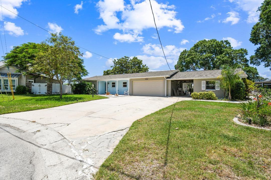 Location, Location, Location!  This is your opportunity to customize your dream home in Palm Harbor!   This premiere oversized lot on the Westwinds Circle cul de sac in Baywood Village features one and a half parcels with approximately 220 feet of seawall.  Enjoy easy deep-water access to the Gulf with no bridges or obstructions....only a 10 min boat ride to the open Gulf waters! The 10,000 lb boat lift is currently working and has recently been refurbished. This waterfront parcel is being sold as-is for the land value but has potential to be renovated under the FEMA 50% rule as a single-story home.  Please Note:  Hurricane Helene was the first time since this home was built in 1963 that the home has had  flood damage.   In the family friendly, boat loving community of Baywood Village, you are also only minutes from the Pinellas Trail, Fred Howard Park Beach, Sunset Beach, Honeymoon Island, and Innisbrook Golf Resort as well as right in the middle between both downtown areas of Tarpon Springs & Palm Harbor....so don't miss out on viewing this property if you're ready to start living the Salt Life...Bring your Vision & Offer!