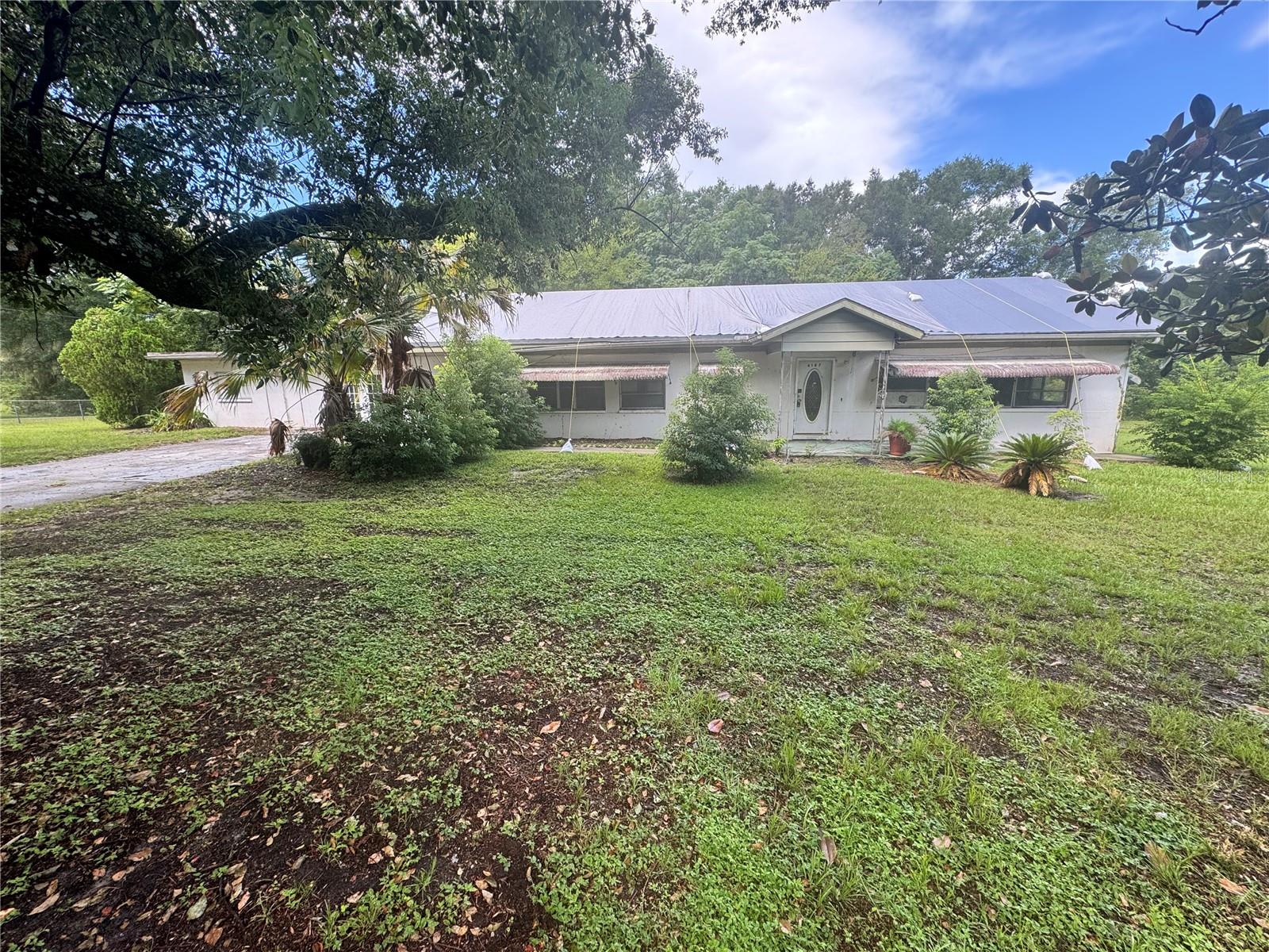 Outstanding opportunity to make this home and property shine once again! Block home opportunity featuring an in-ground pool with no HOA and oversized lot!  .45 AC MOL with pool, two entrances to the property. Home will require re-invention but is a clean slate for your ideas.  3 bedrooms, inside utility room, 3 separate living areas with possibility to convert left side of the home to an in-law suite. Property sold "As-is". Buyer and/or buyer's agent responsible for verifying all pertinent information deemed relevant by the prospective buyer, including but not limited to square footage, acreage, utilities, taxes, zoning, permitting, condition, school zones, HOAs, etc.