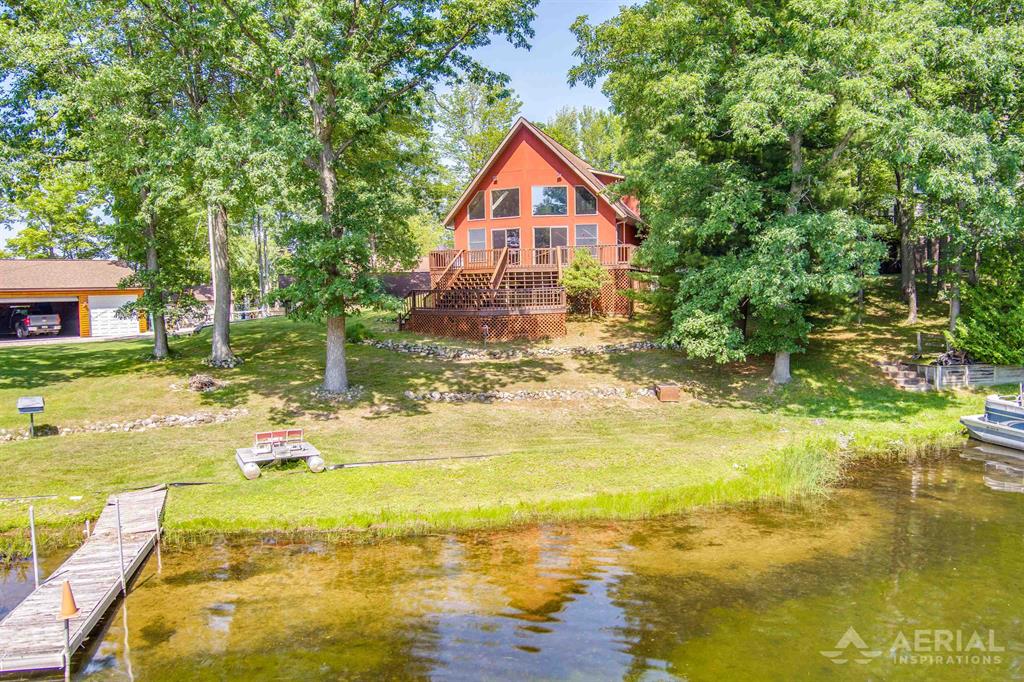 2 Bed, 2 Bath Waterfront Home on Private All-Sports Lake Ogemaw Enjoy lakefront living in this well-maintained 2BR/2BA home on private all-sports Lake Ogemaw. Features include an open-concept living space with panoramic lake views, kitchen area opens to living room and dining room so you can be part of the ongoing activities while entertaining friends or family. A spacious primary suite with large walk-in closet as well as a large walk-in shower. A large lakeside deck perfect for entertaining or just enjoying the beauty of the lake. This hone comes with a backup generator and attic fan. Large sloping front yard with private dock, and firepit. Attached 2-car garage offers plenty of storage. Ideal for year-round living or a seasonal getaway. Dont miss this opportunity to own a waterfront retreat in one of Northern Michigans most desirable lake communities. Approximately 15 minutes off of I 75 or 15 minutes to downtown West Branch for shopping, dining and additional entertainment. Additional photos to follow soon
