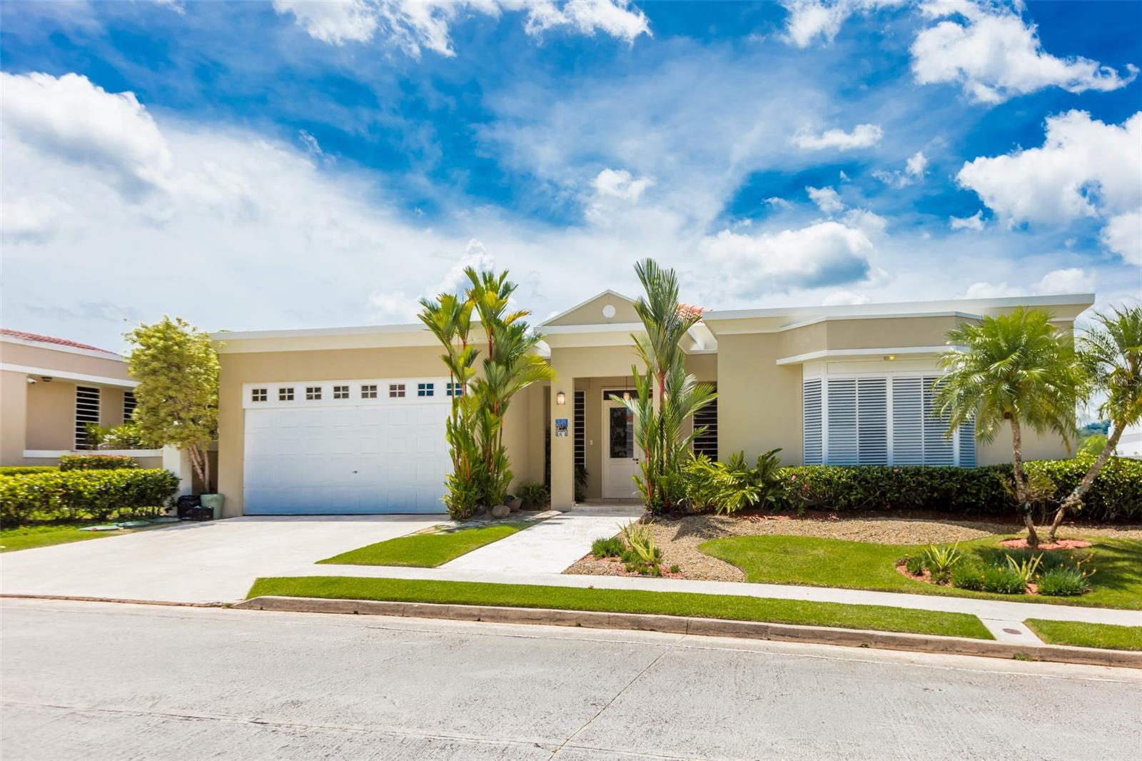 Discover refined living in Paseo San Juan in Los Paseos with this exceptional single-story luxury residence located in one of San Juan’s most desirable communities. This elegant home offers a gross area of 4,178 square feet, including 3,121 square feet of interior living space, situated on a 931.5 square meter lot. Featuring 4 spacious bedrooms, 4 full bathrooms, 1 powder room, and a separate maid’s room, the property is designed for both comfort and functionality. Additional highlights include a garage for two vehicles, expansive terrace, beautifully landscaped grounds, marble floors throughout, and is offered including appliances and AC units. Essential conveniences such as a gas power generator and water cistern provide peace of mind, making this remarkable residence the perfect blend of luxury, style, and practicality. Los Paseos is a well-established residential community located in the Cupey sector of San Juan, known for its suburban atmosphere, family-oriented environment, and convenient access to major roads, schools, shopping, and business districts. It is considered one of the more desirable inland neighborhoods for buyers seeking larger homes, privacy, and a quieter lifestyle while remaining close to metropolitan San Juan. HOA Fees:  $292.50-monthly (including Los Paseos and Paseo San Juan)     Private showings are only by appointment in advance. Please call Eduardo Sánchez at 787-920-8668