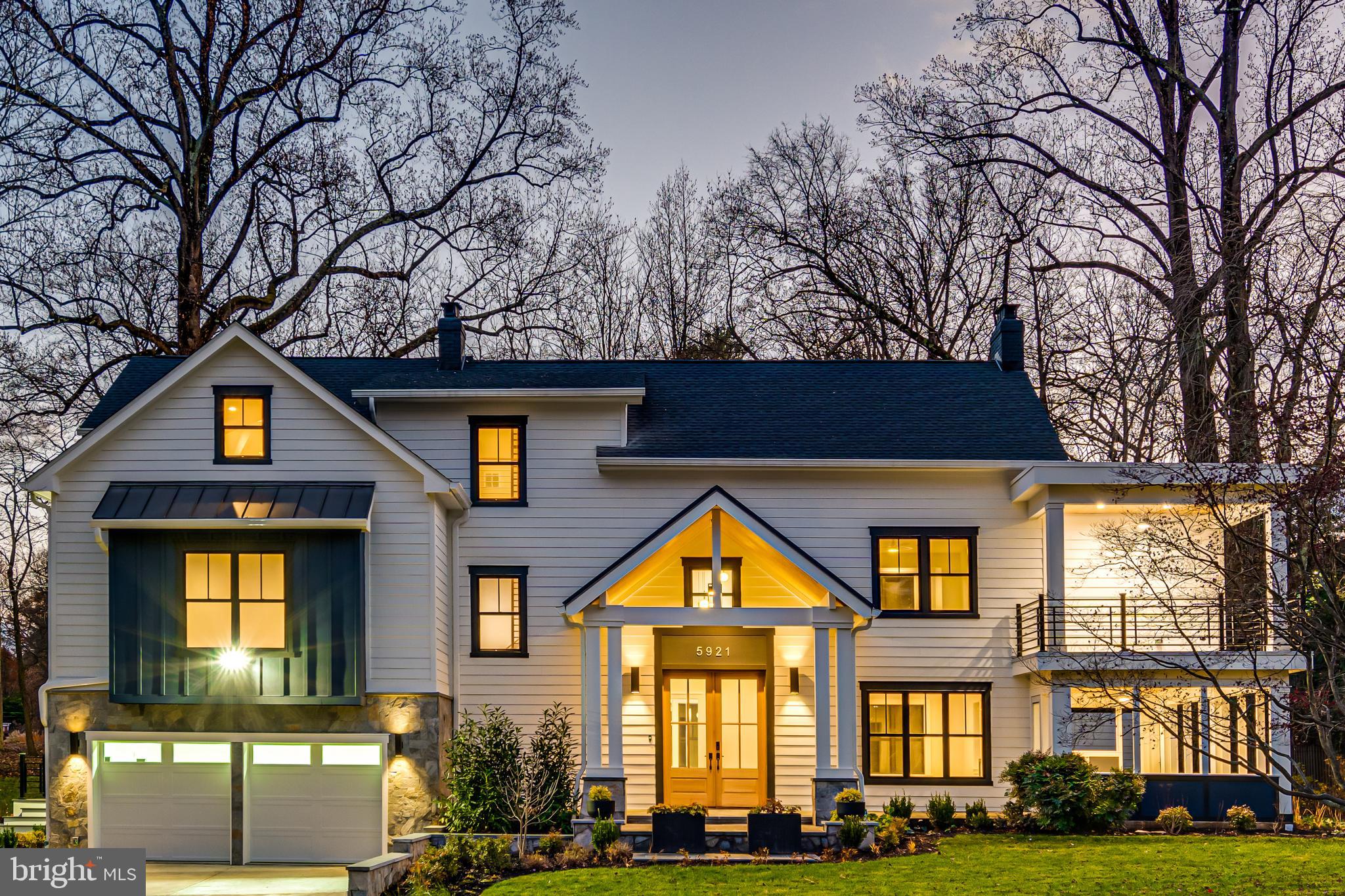 Just imagine yourself at home in this striking, custom-built residence by McLean-based ADS Design Build—a home where every line, finish, and space has been intentionally crafted to elevate daily living. Sited on a flat .37-acre lot in the coveted Chesterbrook Woods neighborhood, this 4-level, 5,700+ SF exceptional residence blends distinct architectural moments with warm, organic materials that invite you to slow down and stay awhile. Picture yourself stepping through the covered front entry into an airy foyer anchored by a dramatic open stair tower and custom Jatobá wood screen wall, a preview of the meticulous millwork that unfolds throughout the home. Natural light pours through Marvin Elevate windows, illuminating the red oak floors and designer-selected surfaces that define each room. The kitchen—thoughtfully designed with ROC custom cabinetry, a waterfall island, and Thermador and Bosch appliances—is a space where conversations linger and mornings unfold softly. Open sightlines draw you into the expansive family room with vaulted ceilings, twin skylights, and serene views of the backyard. Just beyond, the open dining room and welcoming living room—anchored by a natural gas fireplace with Calacatta Gold surround and Virginia Mist mantel—create a beautifully connected environment ideal for spirited gatherings and quiet evenings alike. Slide open the full-width mahogany door and step onto the flagstone screened porch, where you can practically feel the cool crisp morning air as you sip your coffee among the trees. Upstairs, the primary suite feels like a sanctuary—complete with a private balcony, a custom walk-in dressing room, and a spa-quality bath featuring marble basketweave flooring, a rainfall shower, and a freestanding whirlpool tub. Three additional bedrooms offer generous proportions, custom closets, and beautiful natural light while both ensuite and hall bathrooms feature porcelain tile, smart toilets, and designer plumbing fixtures. The finished attic level surprises with a large recreation loft, wet bar, and a two-level bonus space perfect for creative pursuits, home office use, fitness, private guest quarters, or additional bedroom. The lower level invites both relaxation and entertainment, offering a sophisticated media room with gas fireplace, a fully outfitted kitchenette, bedroom suite, and wine storage.  Outside, professionally designed landscaping gently frames the architecture, while a matching 100 sq ft shed blends seamlessly into the scenery. All of this sits just one stoplight to DC, with effortless access to Arlington, Tysons, and Bethesda as well as parks, hiking trails, and commuter routes—an unbeatable combination of tranquility and connectivity. This is the kind of home you feel as much as you see—crafted with intention, built with integrity, and ready to be lived in beautifully.