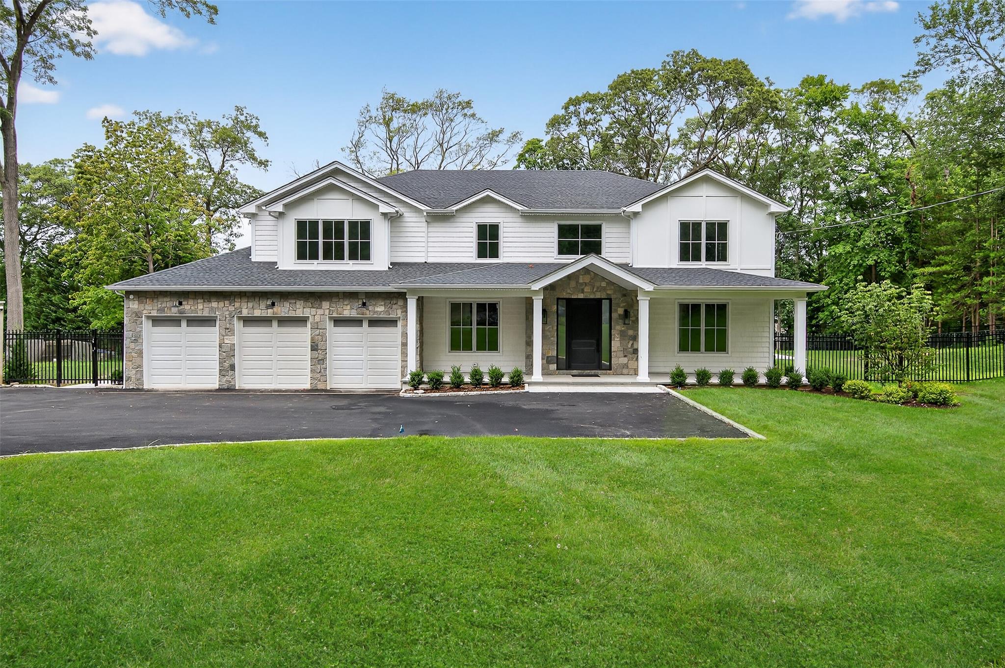 Impressive New Construction by Prominent Builder! Stunning Masterpiece of Modern Luxury Living nestled in the heart of North Syosset in a lush tree lined neighborhood. Hampton Style Center Hall Colonial with formal 2 story entry showcases elegance and sophistication on one acre of tranquil property. A custom stone & shake exterior showcases the eye-catching curb appeal of this residence. Abundant natural light, high ceilings, custom moldings & beautiful oversized wide-plank White Oak flooring set the stage for this amazing home. This special floor plan highlights architectural excellence with the finest attention to detail. The banquet sized Chef’s Eat-in Kitchen has top-of-the-line Deluxe Appliances & a walk in pantry. The Great Room features a Modern linear gas fireplace with floating built-ins. All Designer Bathrooms, Exquisite primary bedroom with ultra-luxury spa bath and his & her furniture quality walk-in closets plus 4 Additional En-suite Bedrooms, all of which feature walk-in closets and one of which is conveniently located on the first floor. A large mudroom with side door entry is located behind the 3 car garage & a grand 10-foot high basement is partially finished and offers a wealth of potential for personal customization. This show stopping property has been designed with an infinity terrace & hi-end pool with spa, sun deck & automatic retractable cover. This home blends exceptional craftsmanship with thoughtful design, making it a premier choice for those seeking luxury, amenities & convenience. Located In the Renowned Award-Winning Syosset School District. This Unique Residence Is Near Golf & Country Clubs, Fine Dining, Shopping & Transportation.