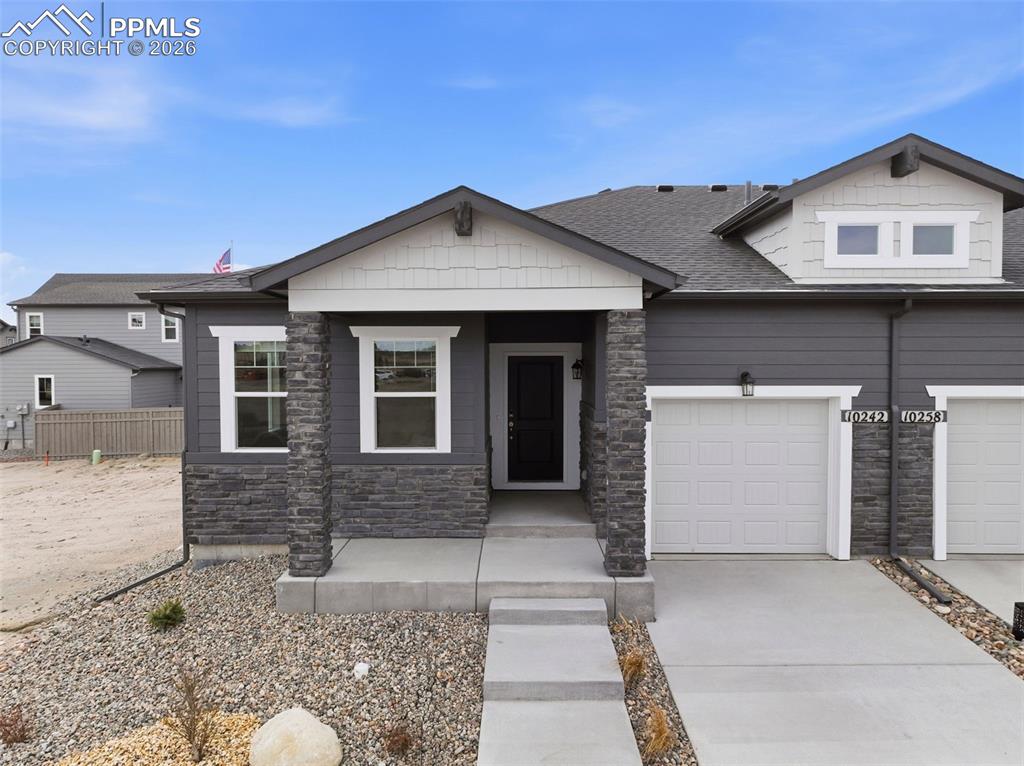 Ready now! Valley ranch plan with 1 car garage in Wolf Ranch.  2 bedroom, 2 bath home. This home is one side of a duplex.  Kitchen features Shaker-style white cabinets, Artisan Grey Quartz countertops in a leathered finish, island that seats 3, pantry, and stainless steel appliances including gas range and refrigerator. The main level primary bedroom hosts a walk-in closet. The primary bath showcases a shower with seat and vanity with double sinks. The primary bedroom is separated from the secondary bedroom creating a quiet, serene space. Enjoy the outdoors on the rear patio accessed from the great room. Home comes equipped with blinds in the bedrooms and bath, air conditioning, smart home package, washer/dryer, and radon mitigation system. Home is located in a covenant protected community. Full yard xeriscaping included.