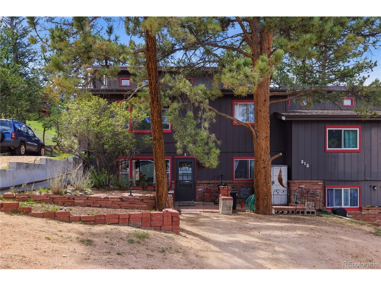 Most people come to Estes Park for the weekend... then start wondering what it would be like to actually live here. This is a rare property, with a low $50/month HOA and can be used as an Airbnb or short term rental (must apply for license)Welcome to this updated 2 bed, 2 bath first-floor condo at 515 Driftwood Ave #1 in Estes Park. Featuring updated bathrooms and kitchen with granite counter tops, newer LVP flooring, easy main-level living, and the kind of peaceful mountain lifestyle people spend all year chasing. The large living room is bright and features a gas fireplace, the kitchen is spacious and has a pantry for additional storage. The primary bedroom features an en suite bathroom with updates shower and vanity, and has a sliding glass door to the backyard deck (the only unit in this fourplex with one!) so you can enjoy peaceful views of Estes Park and enjoy the deer year round. Minutes from hiking trails, downtown Estes Park, Lake Estes, breweries, coffee shops, restaurants, and Rocky Mountain National Park. Morning coffee with mountain air hits different up here. UC Health is only a few blocks away. Low-maintenance mountain living. Elk sightings. Cool summer nights. And views that will turn into forever memories.