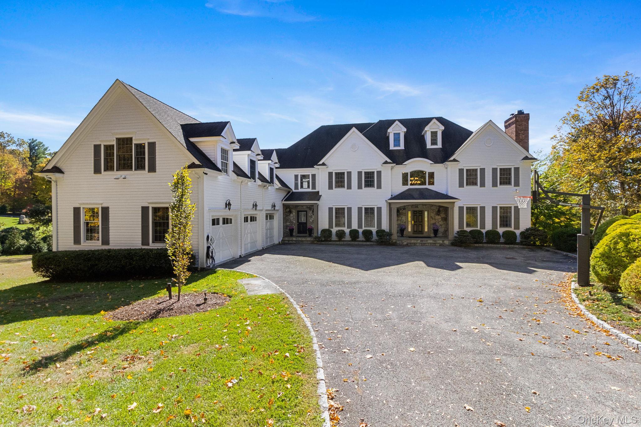 Welcome to an incredible retreat in beautiful Bedford, NY! This stunning 5-bedroom, 6.5-bath home spans over 10,000 square feet of elegant living space on nearly two acres of private land. From the moment you arrive, you will feel the warmth and sophistication of this well-designed residence.Step inside to find a gracious formal living and dining room that sets the tone for memorable gatherings. The expansive family room flows easily into a chef’s kitchen, complete with high-end appliances, custom cabinetry, and access to a spacious deck overlooking the grounds. The first-floor en-suite guest bedroom provides comfort and privacy, while the dedicated office offers a quiet place to focus or create.Upstairs, the primary suite feels like a personal getaway—featuring a cozy fireplace, two walk-in closets, a private balcony, and a luxurious bathroom designed for total relaxation. Three additional en-suite bedrooms and a wonderful bonus room complete this level, ensuring everyone has their own space. The lower level adds even more to love, with a media room for movie nights, a private gym, a walk-in spa like sauna, and a large family/game room with a full bar and bath that opens directly to the pool area .Outside, you’ll find a resort-like setting with an infinity-edge pool, relaxing spa, outdoor kitchen, and fire pit—perfect for unwinding or hosting. Set just 10 minutes from Scott’s Corners and downtown Bedford, this home blends tranquility with convenience, offering the best of refined living in a private, peaceful location.