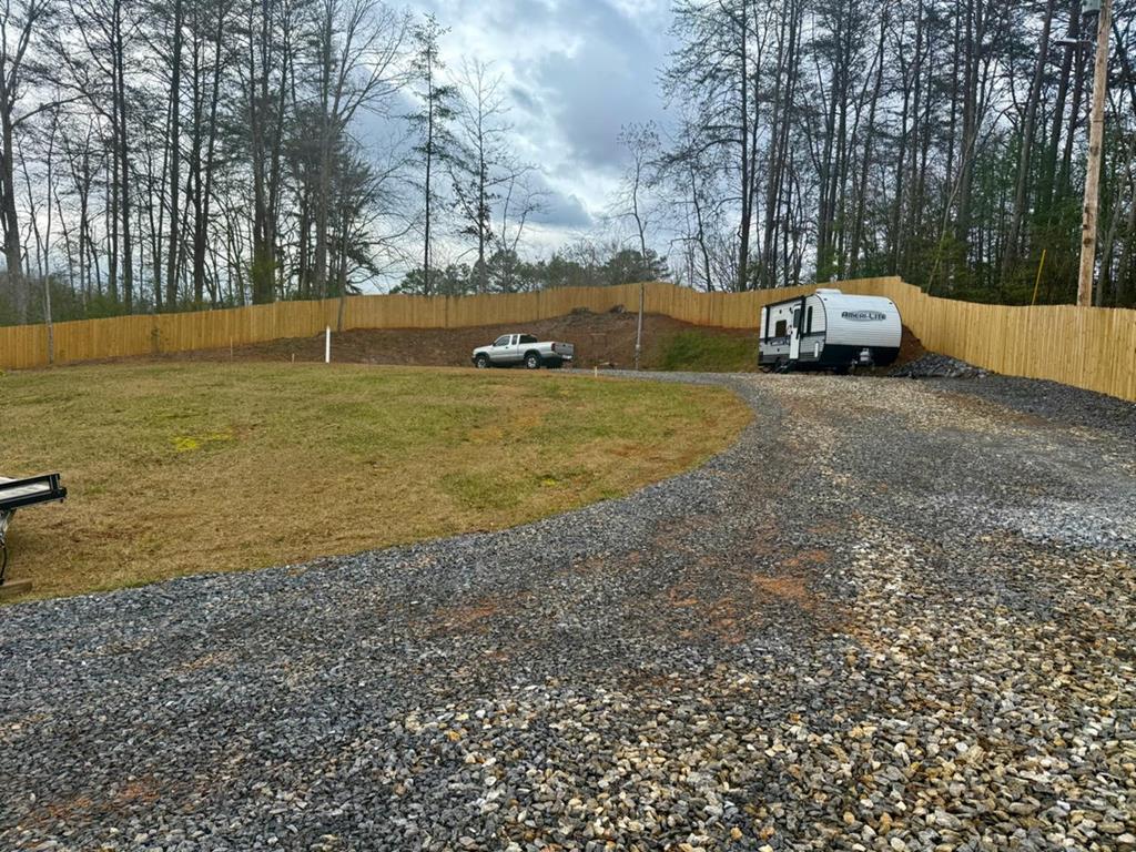 Unrestricted and fully prepped, this .67-acre parcel is ready for your RV or future home build - no delays, no guesswork. With city water, septic system, electricity, a leveled house pad, and fiber optic internet available, all the essentials are already in place. Set along a paved road with a mix of level and gently rolling terrain, the property offers pasture, wooded, and long-range views that frame the land with natural beauty. Whether you're planning a permanent residence or a private getaway, this turnkey setup gives you the freedom to start living your vision immediately.