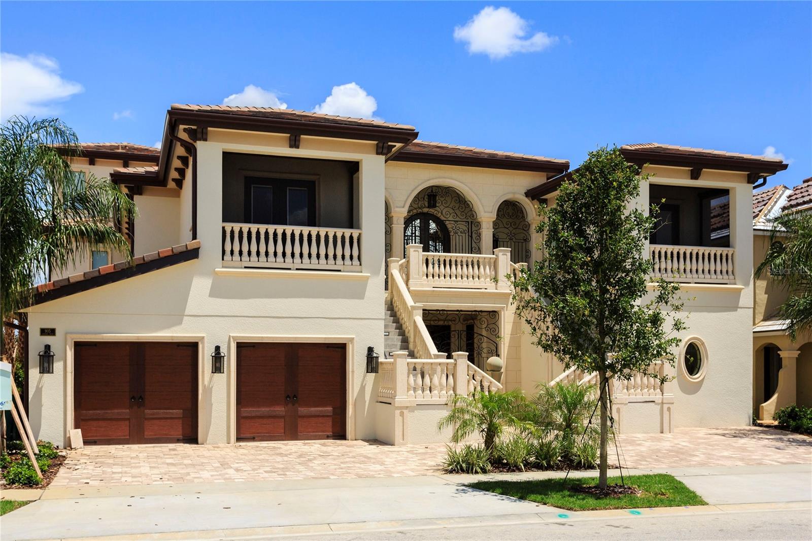 Welcome to the Golden Bear Mansion, an extraordinary 10-bedroom custom estate situated on an oversized double lot in the renowned golf community of Reunion Resort this one-of-a-kind residence offers an unmatched collection of luxury amenities rarely found in a private home. The striking front façade immediately sets the tone, highlighted by dramatic dual travertine staircases that lead to a fully covered balcony with retractable screens—perfect for enjoying the Florida lifestyle year-round. Inside, regal entry doors with Oni signature hands-free automatic operation welcome you into the grand atrium and the first of several spectacular entertaining spaces. This area features a full chef’s kitchen with high-end commercial appliances, custom quartz countertops, marble-inlaid flooring, and a card lounge with multiple televisions. Beyond the main entertaining area, a custom vestibule leads to several remarkable spaces including a private 12-seat movie theater, the main entertainment living room, a two-lane bowling alley, and access to the fully finished lower level. The finished basement offers an incredible collection of wellness and recreation amenities, including a private massage room, a full indoor basketball court with a retractable hoop that converts the space into a squash court, locker facilities with his-and-hers showers, a sauna, and a steam room. The wellness experience continues with an indoor spa featuring a hot tub and heated lounge chairs, as well as a fully equipped private fitness center. On the second level, the formal living room flows seamlessly into a stunning custom kitchen anchored by a massive single-slab quartz island. A grand hallway showcases tray ceilings, marble inlaid floors, dramatic chandeliers, and elegant architectural details throughout. This floor also hosts beautifully designed guest suites, each uniquely styled with tray ceilings, private en-suite bathrooms, custom showers, and thoughtful luxury touches such as heated towel racks. The third level functions perfectly as a private multi-generational suite, complete with its own kitchen, living room, and two expansive primary suites. Each suite features spa-inspired bathrooms, including one with a steam shower and another with a Jacuzzi tub with a hidden television. Outside, the resort-style pool area overlooks the renowned Jack Nicklaus Signature Golf Course at Reunion Resort and is designed for ultimate relaxation and entertainment. Enjoy an oversized pool with a waterslide and built-in spa, travertine decking, a custom swim-up bar, and a pavilion with retractable screens and a fire pit—perfect for entertaining in style. This exceptional estate offers far more than words can capture. Experience the Golden Bear Mansion in person and discover one of the most remarkable luxury homes in Central Florida.