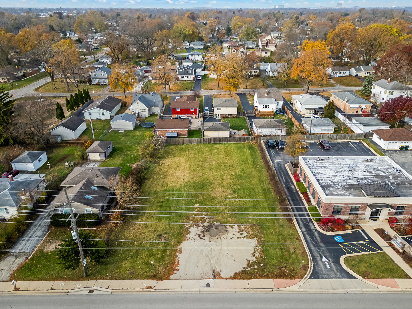 Explore a fantastic opportunity to develop your ideal commercial office space or residential home on this versatile 50' by 150' foot vacant lot. Perfect for a medical office or a variety of small businesses. For more extensive plans, combine this lot with the adjacent lot at 3918 N. Cass to achieve a generous 100' by 150' foot space. Conveniently located near Ogden Avenue and shopping centers, this property offers both accessibility and potential.