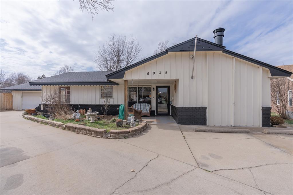 Set on just under a half-acre, this inviting home blends space, comfort, and an ideal Northwest OKC location. An open-concept layout flows between two distinct living areas anchored by a striking wood-burning stone fireplace perfect for cozy nights in or effortless entertaining. The private primary suite includes an en-suite bath and direct access to the covered patio. Two additional bedrooms share a full bath with an extended vanity and a sleek, tiled shower. Outdoors, relax on the large covered porch overlooking a beautifully landscaped yard with mature trees your own serene backdrop for morning coffee or weekend gatherings. A two-car garage plus a semi-circular drive offer ample parking for family and guests. All of this just minutes to NW Expressway, with convenient access to shopping, dining, and entertainment throughout Northwest OKC.