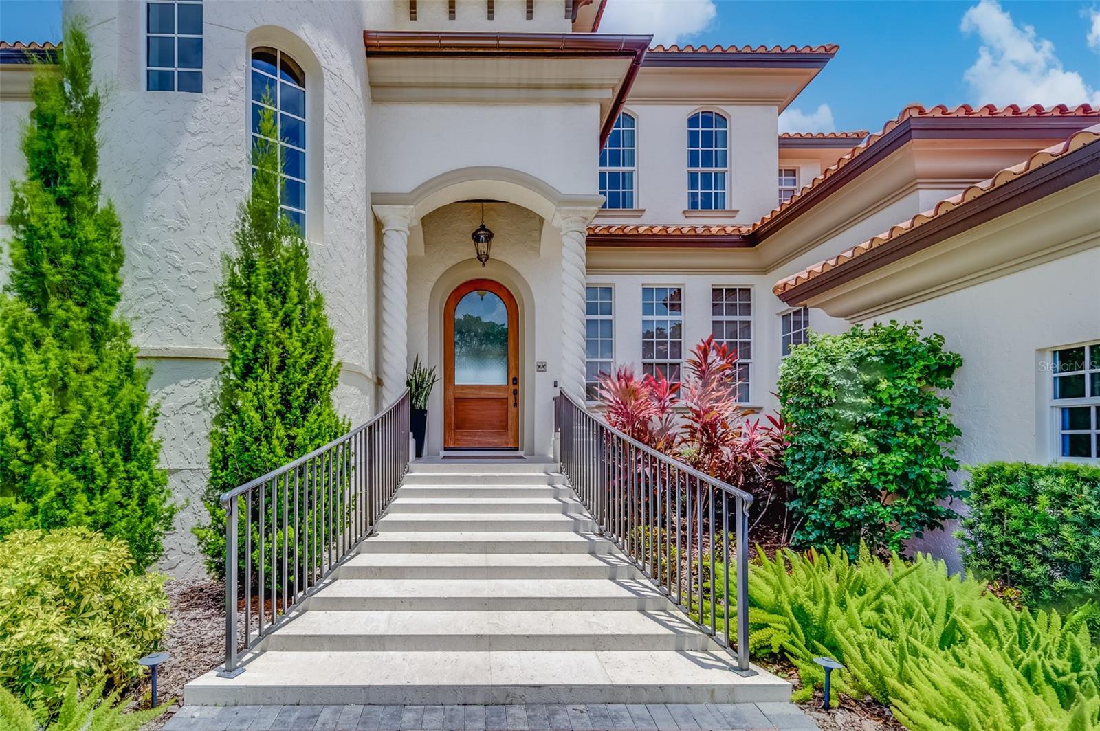 Exquisite Coastal Waterfront Luxury Home on St. Pete Beach
Indulge in the epitome of refined coastal living with this spectacular waterfront 4-bedroom, 4-bathroom pool residence, located in one of the most coveted enclaves of St. Pete Beach. Offering over 4,475 square feet of unparalleled elegance, this 2007-built masterpiece has been meticulously designed to ensure comfort, security, and opulence at every turn.

This property boasts a wealth of recent upgrades that enhance both functionality and luxury. Equipped with a state-of-the-art Luma View Security System, your peace of mind is always assured. The residence remains in pristine condition, having withstood both recent hurricanes without sustaining any water damage, a testament to its solid construction and thoughtful design.

Upon entry, you're greeted by a stunning chef’s kitchen that redefines culinary excellence. Featuring custom cabinetry, a professional-grade gas range, a sprawling walk-in pantry, and quartz countertops, it’s a space meant for creating unforgettable meals. A spacious island serves as the heart of the kitchen, perfect for gatherings and casual dining. For those who enjoy entertaining, the adjacent wet bar, complete with a wine fridge, is ideal for hosting guests in style.

The home’s expansive layout is bathed in natural light, thanks to the large hurricane impact windows throughout, providing both safety and beauty. A sweeping staircase leads you to the second floor, where newly installed hardwood floors add an element of warmth and sophistication. Custom drapery and window treatments complement the space, further elevating the home’s luxurious feel.

The newly remodeled media room is an entertainer's dream, featuring a built-in bar and ample space for watching movies or relaxing with friends. Whether it's a cozy movie night or an elegant cocktail party, this room effortlessly sets the tone for any occasion.

Step outside into your own private paradise. The backyard is a tropical oasis designed for ultimate relaxation and enjoyment. Take a refreshing dip in the saltwater pool, surrounded by lush, newly landscaped gardens. A new pool pump installed in February, ensures that every element of this home is in impeccable condition.

For boating enthusiasts, the 63 feet of pristine waterfrontage is complemented by a new sea wall, a 2021 Trex dock, and a 30,000lb boat lift (installed in 2022), offering easy access to the open water. Whether you're an avid boater or simply love watching the marine life play from your dock, this residence is the perfect place to do both.

This coastal gem also features a water treatment system that softens and filters the water throughout the entire home, ensuring every drop is pure and perfect. With a 2-car garage and an array of high-end amenities, including a top of the line washer and dryer, Control 4 Audio-Visual System, and all TVs, no detail has been overlooked.

Located just minutes from the pristine sands of St. Pete Beach, this property offers the ideal blend of luxury, privacy, and coastal charm. A true sanctuary, this home is waiting to become your own personal retreat.