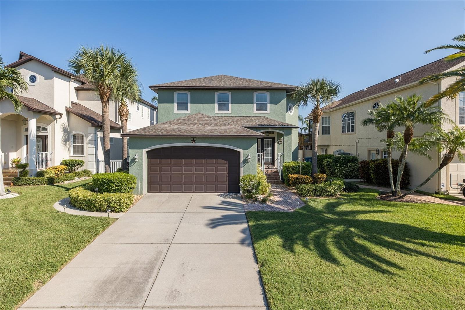PRICED TO SELL! Come live the Florida Lifestyle! EXCEPTIONAL WATERFRONT POOL home nestled in the highly sought after Gulf Harbors Sea Forest community. TRANSFERABLE FLOOD INSURANCE ONLY $1,095/YEAR! Immediately notice the BEAUTIFUL curb appeal, LONG DRIVEWAY, and 2-Car Garage that provides plenty of off street parking. FANTASTIC OUTDOOR living space! GREAT for ENTERTAINING! Splash into the AMAZING SALT System POOL or enjoy the SPACIOUS DOCK + 10,000 lb. BOAT LIFT (with brand new motors) minutes to the Gulf of America! Upon entering this IMMACULATE home, be overwhelmed with the WOOD FLOORS + impressive gas FIREPLACE + tons of NATURAL LIGHT. GOURMET eat-in kitchen has BREAKFAST BAR + STAINLESS STEEL appliances. Family room with French doors out to the TWO STORY SCREENED-IN LANAI + POOL BATHROOM! Separate DINING ROOM + DEN + Half Bathroom. PRIMARY SUITE including TWO walk-in closets + SPA-LIKE primary bathroom with DUAL SINKS and LARGE SHOWER + French doors out to a LARGE BALCONY. Two Additional Bedrooms with conveniently located FULL BATHROOM.  Upstairs Laundry near all bedrooms. Exclusive Gulf Harbors Sea Forest Community offers Pool + Clubhouse + Tennis Courts + Community Boat Ramp + Private Beach! Located near restaurants + shopping + major highways. Schedule your private showing today! NO DAMAGE OR FLOODING DURING HURRICANES HELENE OR MILTON!