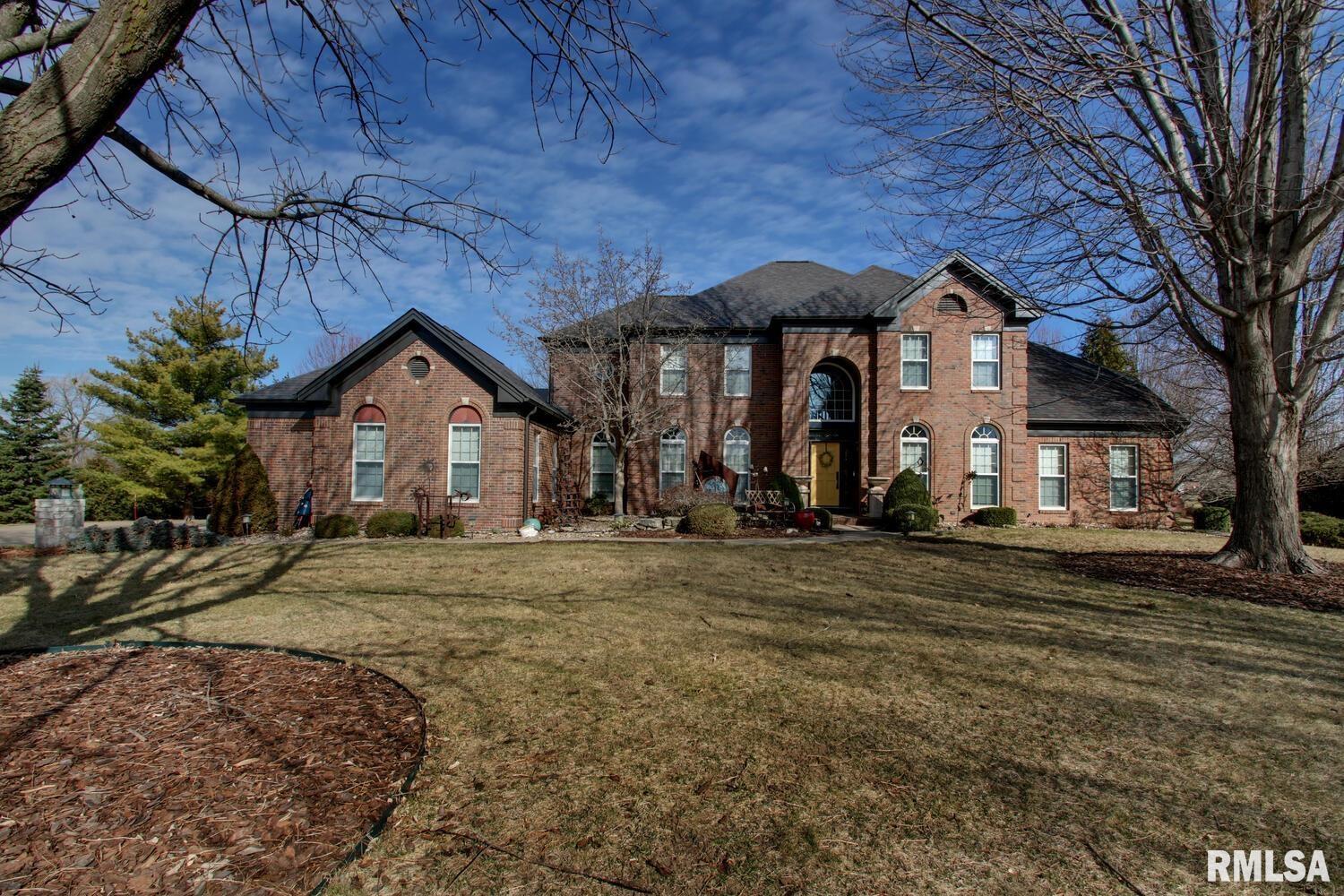 Stunning, well-maintained Colonial in desirable Spring Lake Estates — 4 beds, 4.5 baths (each bedroom has it's own en suite) and 4,985 sq ft of living space. This home lives like a retreat with a remodeled kitchen, generous island with gas cooktop, formal dining, bright breakfast nook, home office, main-level master suite, finished lower level recreation space, two fireplaces, three-car garage and thoughtful built-ins throughout. Enjoy effortless indoor/outdoor living on the private 1.32-acre lot with multiple decks and direct access — this property sits right on the Spring Lake Country Club cart path for quick access to the pool or the golf course. Minutes to schools, shopping and community parks; exceptional value for golf-course living.