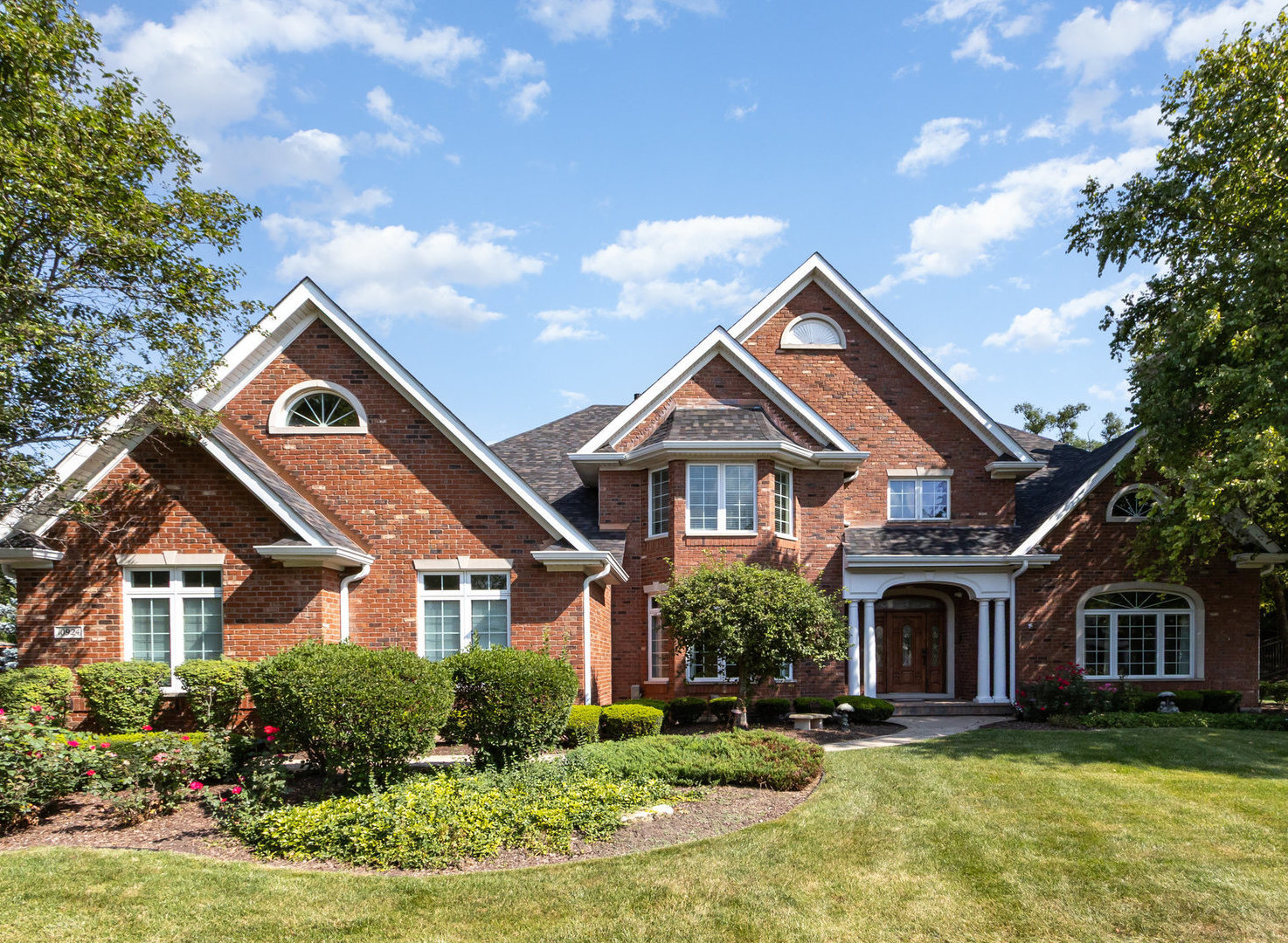 Discover understated elegance in this stylish two-story contemporary executive residence. Perfectly designed for both grand entertaining and cozy family living. The back of the house offers stunning views of the landscaped yard, mature trees, vibrant gardens, and underground pool. The gourmet kitchen features custom two-tone cabinetry, granite countertops, a spacious island, and a walk-in pantry, all equipped with high-end appliances for effortless cooking and hosting. The property includes related living space with a private entrance, bedroom, and full bath on the main level. The luxurious master suite features a fireplace, a sitting area, an elegant bathroom, and a generous 30'x10' closet. The finished basement boasts a designed home theater with a bar and a second kitchen plus full bath , perfect for guests or flex living space. Outdoors, enjoy an inviting terrace, in-ground pool with fountains, firepit, grill station, and plenty of room for fun and gatherings, fenced yard.  Additional features include four fireplaces (including one limestone), a 3.5-car garage, New Roof, remodel bathrooms, whole house generator, heated pool with fountain, remodel basement and an array of premium upgrades-spectacular and ready for you to see!