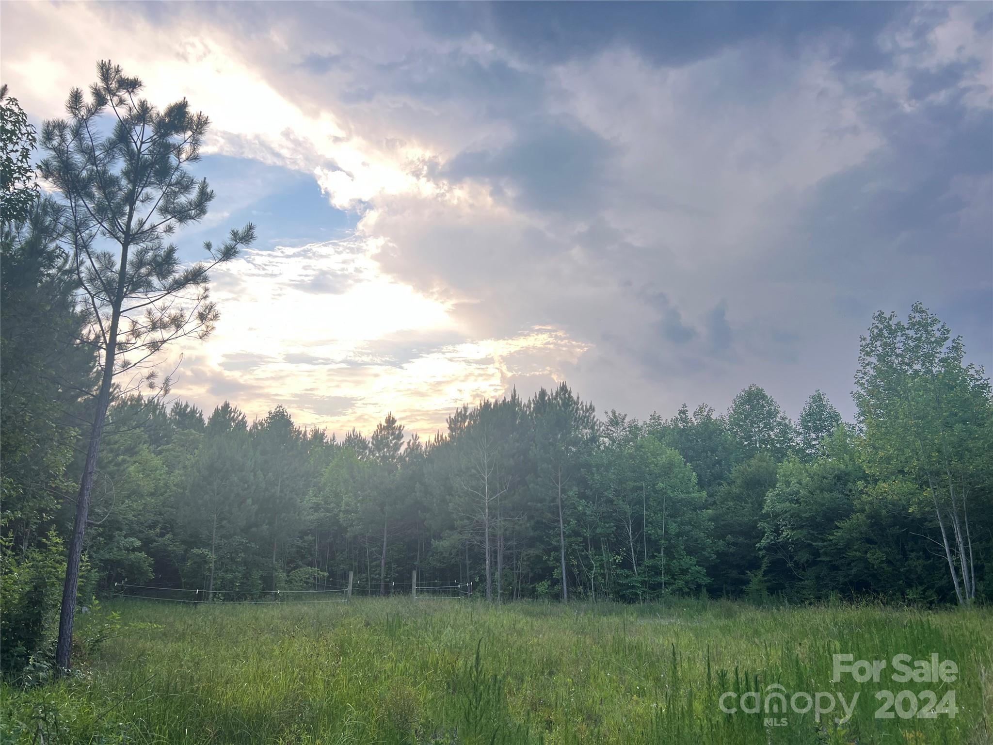 10 Acres of privacy. As the seller said, the road can't see you and you can't see the road. Small stream on property. Close to Uwharrie National Forest and Badin Lake. No perk test has been completed for a septic system.  Lot is heavily wooded with a cleared gravel driveway and a small cleared section. Currently in the farm program for Montgomery County.  There is a creek on the property, and when landscaped will be a beautiful enhancement to the entrance of this property.  Pipe has been installed under the driveway for the creek to flow under during heavy rains, and a swell installed on the opposite side of the driveway for overflow.  Property is NOT located in the Flood Zone.