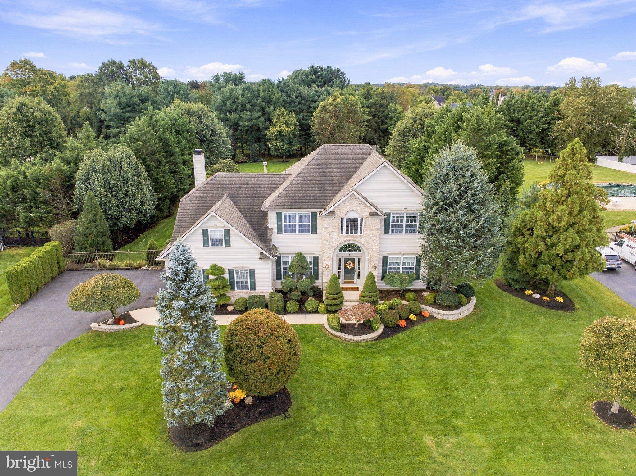 Welcome To This Beautifully Appointed Ashford Grand Model  In Lumberton’s Highly Desirable Powells Mill Estates, Where An Exceptional Cul-De-Sac Location, Nearly One Acre Of Meticulously Maintained Grounds, And A Bright, Move-In-Ready Interior Come Together To Create Something Truly Special. Tucked Away On An Expansive Cul-De-Sac With Plenty Of Room For Safe Neighborhood Play, This 4 Bed, 2.5 Bath Home Offers The Space, Setting, And Lifestyle You’ve Been Looking For. Step Inside The Impressive Foyer, Where Brand-New Hardwood Floors And A Striking Staircase With Wrought-Iron Railings Set The Tone. Double French Doors Open To A Private Home Office, While The Spacious Formal Living Room Flows Through Stately Columns Into The Dining Room, Beautifully Accented With Wainscoting. At The Heart Of The Home Is A Bright, Welcoming Kitchen Featuring Rich Maple Cabinetry, Granite Counters, Stone Backsplash, Pantry, Center Island With Seating, And Luxury Vinyl Tile Flooring. Sliding Glass Doors Lead Directly To A Truly Spectacular Backyard—And One Of This Home's Biggest Highlights.Set On Nearly An Acre, The Fully Fenced, Tree-Lined Backyard Is Beautifully Landscaped And Offers An Incredible Amount Of Lush Green Lawn With Plenty Of Room To Play, Entertain, Garden, Or Simply Enjoy The Privacy. An EP Henry Paver Patio Creates The Perfect Gathering Space, While A Step-Up Paver Dining Area Provides Another Inviting Spot For Outdoor Meals And Summer Entertaining. A Charming Backyard Shed Adds Character And Functionality To This Already Picture-Perfect Setting.Back Inside, Just Off The Kitchen, Step Down Into The Dramatic Family Room With A Soaring Vaulted Ceiling, Cozy Gas Fireplace, And Beautiful Arched Windows That Fill The Space With Natural Light. A Convenient Laundry/Mudroom With Access To The Two-Car Garage And A Powder Room Complete The Main Level.Upstairs, Retreat To The Oversized Primary Suite Featuring Newer Carpeting And An Incredible 19 X 14 Walk-In Closet With Organizers—A Room Unto Itself! The Updated Ensuite Bath Offers Dual Sinks, A Tiled Soaking Tub, And Separate Tiled Shower. Three Additional Generously Sized Bedrooms, All With Newer Carpeting, Share A Full Hall Bath.The Finished Basement Adds Even More Living And Entertaining Space With A Comfortable Sitting Area And Bar, While A Large Unfinished Section Provides Plenty Of Storage. Beautifully Maintained And Thoughtfully Updated, This Home Offers Additional Peace Of Mind With A Roof Approximately 9 Years Young, HVAC Approximately 6 Years Young, Recently Painted Interior, Brand-New Hardwood Flooring (2026), 3-Year-Young Luxury Vinyl Tile In The Kitchen And Laundry Room, And 2-Year-Young Upstairs Carpeting. Additional Features Include A Whole-House Humidifier, High-Efficiency HEPA Filtration System With UV Lights In The Ductwork, And Sonos Sound In The Family Room And Backyard. All Of This In A Sought-After Lumberton Neighborhood Close To Schools, Shopping, Dining, And Major Roadways, With Convenient Access To Philadelphia, The Train To NYC, And Joint Mcguire AFB. Beautifully Updated, Impeccably Maintained, And Perfectly Positioned—This Is The Kind Of Home And Setting That Is Increasingly Hard To Find.