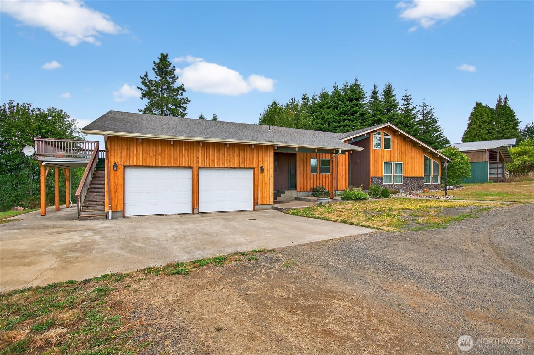 Discover this unique 4-bed Cathlamet home on 4.3 acres with stunning valley views. The great room features large windows, natural pine ceilings, and built-in dining hutch for storage. Enjoy an updated kitchen with Silestone counters and copper accents, plus a cozy coffee bar. With a built-in sauna in the upper bedroom, custom bookshelves, a spiral staircase, and plenty of space, this home blends character and potential. The property has established fruit trees, garden space, a small greenhouse and large workshop. Just a 3 minute drive to small-town Cathlamet, with a marina, brewery, restaurants and access to the Columbia River. Savor gorgeous sunrises and sunsets from the upper deck and settle into a friendly neighborhood!