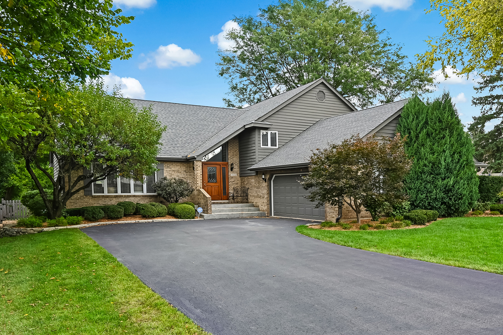 Welcome to this spacious 5-bedroom, 3-bathroom split-level home in Darien's sought-after Brookeridge Creek subdivision! Offering approximately 4,000 sq ft of living space, this home provides an abundance of room for everyday living, entertaining, and growing. Situated on nearly 1/3 acre with a fully fenced yard, there is plenty of outdoor space to enjoy.  Inside, fresh paint and new carpeting throughout create a clean, move-in-ready feel. The main living areas offer generous space and flexibility, while the additional levels provide plenty of room for bedrooms, recreation, work-from-home needs, and storage. The 3rd floor features a versatile bonus room that could be used as a home office, playroom, hobby space, or additional living area. The finished sub-basement offers a great recreation room along with a huge storage room.  The upstairs hallway bathroom has been beautifully remodeled, and the primary bathroom features a new vanity. Numerous updates throughout the years provide both style and peace of mind, including a new roof and deck in 2018, an updated sprinkler system controller, new asphalt driveway, and enhanced landscaping in 2019, plus gutter guards added in 2020. The kitchen was updated with a Bosch dishwasher and Samsung oven/microwave in 2021, along with a new water heater.  Major improvements in 2024 include a whole-house Generac generator, two new HVAC units, a new injection pump, and a new sump pump with backup battery. The home also features a new fence, complete siding paint, and a sprinkler meter for sewer credit. A new back door was added in 2025. The 2 1/2 car attached garage offers additional convenience and ample storage.  With 5 bedrooms, 3 full bathrooms, multiple living spaces, a finished sub-basement, 3rd floor bonus room, attached garage, and expansive fenced yard, this Brookeridge Creek home offers the space, flexibility, and extensive updates today's buyers are looking for. Move right in and enjoy a home that has been thoughtfully maintained and improved over the years!