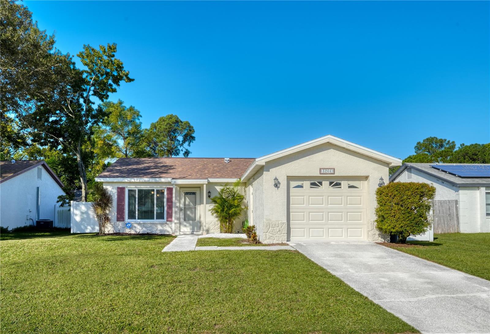 **BRAND NEW ROOF!!** Welcome to 3266 Pine Haven Drive in Clearwater, Florida! This freshly painted, move-in-ready **3-bedroom, 2-bathroom single-family home** offers 1,122 square feet, a 1-car garage, private screened-in lanai, and fully fenced backyard in the desirable Countryside area of Clearwater. With a **NEW 2026 ROOF, WeatherTie PGT Winguard impact storm windows & storm door installed in 2021, and newer stainless steel appliances**, this home combines valuable updates with an exceptional Tampa Bay location!Step inside to discover a bright, freshly painted interior featuring easy-care tile flooring and carpet in two bedrooms. The seller is offering a **$500 carpet allowance** so the buyer can personalize the flooring! Additional features include a convenient laundry room, garage, storage space, 2016 A/C system, front storm door, and fresh paint throughout the interior and garage. Built in 1979 with durable concrete block construction on a slab foundation, this Clearwater home offers practical features and everyday comfort.Enjoy Florida's indoor-outdoor lifestyle from your **private screened-in lanai**, perfect for morning coffee or relaxing evenings. The backyard features a white PVC privacy fence, creating an inviting outdoor retreat for entertaining, gardening, or pets.**LOCATION, LOCATION, LOCATION!** Situated in Clearwater's popular Countryside area, this home is just **3 blocks from the Duke Energy Trail** for walking, jogging, and cycling. Countryside Mall is only 2.3 miles away, **Honeymoon Island State Park and Beach just 6 miles**, world-famous Clearwater Beach approximately 11.8 miles, and Tampa International Airport 16 miles away. Conveniently located near **Curlew Creek Elementary, Palm Harbor Middle, and Countryside High School**.Whether you're searching for a **3-bedroom Clearwater home, a single-family home near Countryside Mall, or a Clearwater property with a new roof and private fenced backyard**, 3266 Pine Haven Drive offers an excellent combination of location, updates, and Florida lifestyle.**NEW 2026 ROOF WITH NEW WARRANTY! 2021 STORM WINDOWS WITH 10-YEAR WARRANTY! FRESH PAINT! SCREENED LANAI! PRIVATE FENCED BACKYARD!** Don't miss this opportunity to own a home in Clearwater's desirable Countryside area. **Schedule your private showing today!**