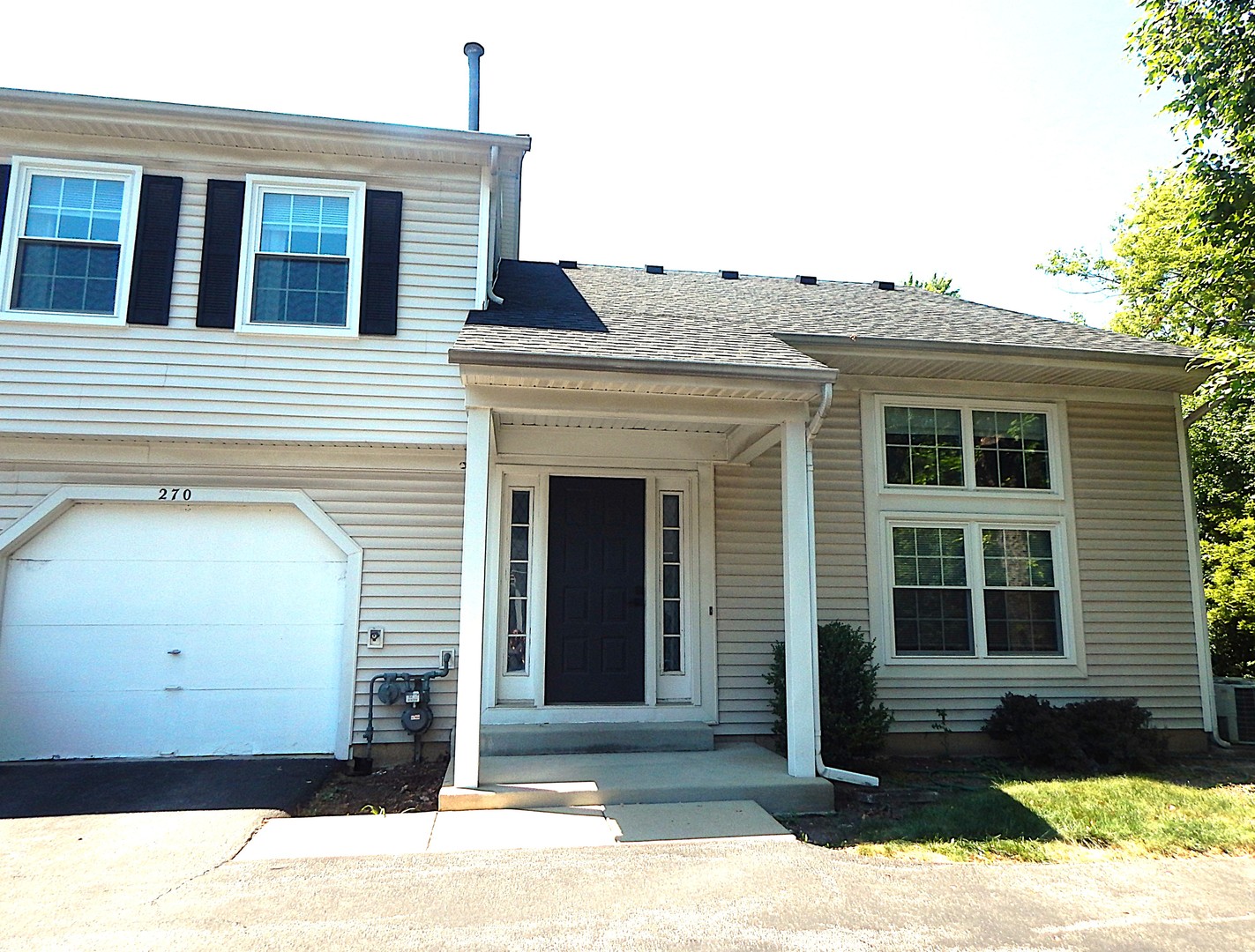 This immaculate end-unit townhome offers 2 bedrooms, 1 1/2 baths, patio and 1 car attached garage on a private setting backing to a wooded park with a fishing lake, sports fields and courts, a playground, and walking paths. The updated eat-in kitchen features stylish cabinetry, a pantry for plenty of storage, all appliances, and luxury vinyl flooring. The main-floor half bath has also been updated, while the spacious family room boasts vaulted ceilings; the convenient first-floor laundry. Upstairs, you'll find two generously sized bedrooms, including a primary suite with a walk-in closet and en suite access to the shared full bath. Fresh paint and new flooring give the home a bright, move-in-ready feel, and the windows and sliding glass door were replaced in 2024.