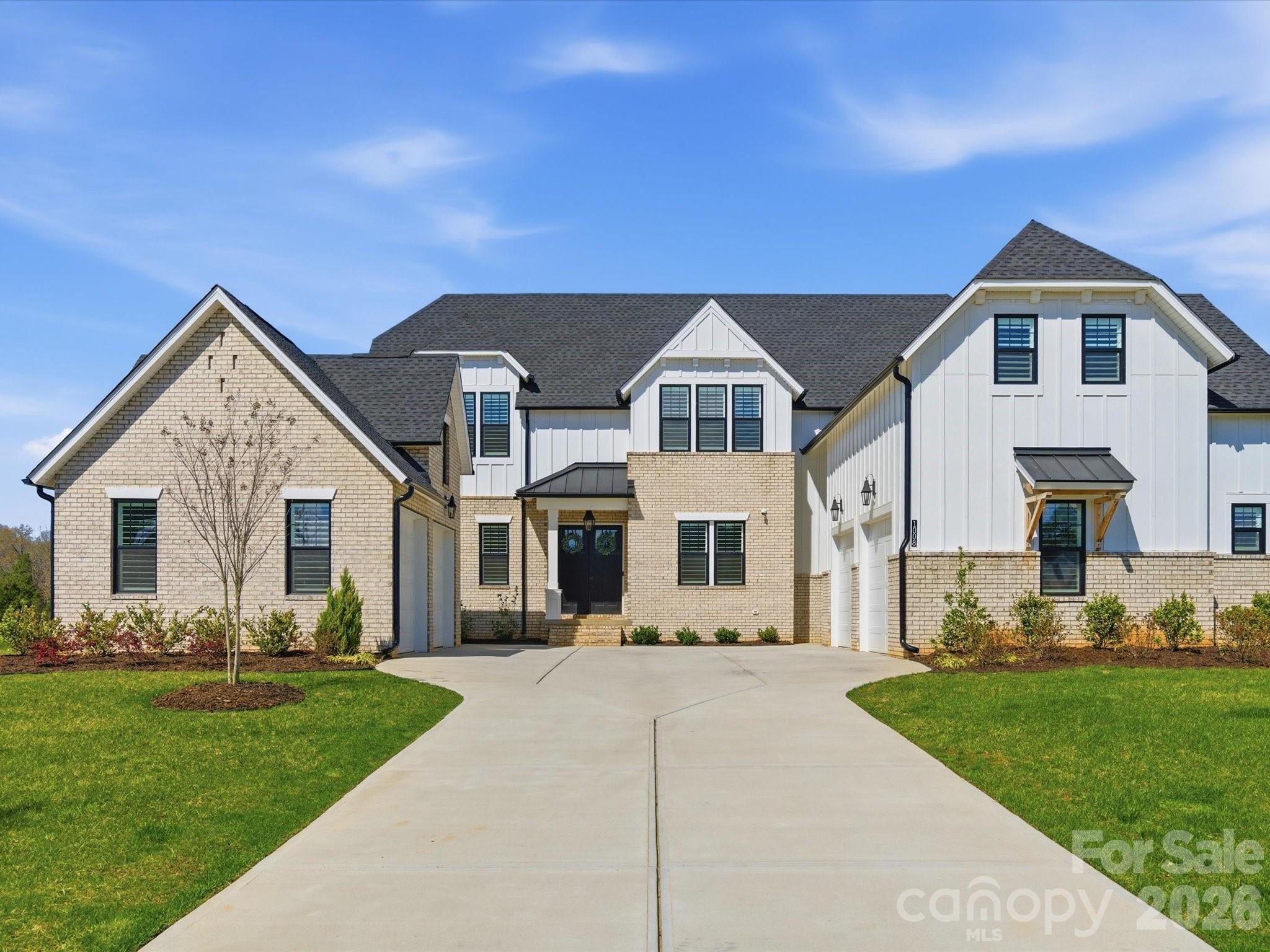 There’s a moment that happens before you even step inside.As you arrive, the home immediately sets itself apart. Dual garages frame the approach, creating a motor court-style entrance that feels both intentional and elevated. It’s not just curb appeal—it’s a sense of presence that’s rare at this price point.Step through the front doors, and everything opens.A wide entry foyer draws you forward into a vaulted living space filled with natural light. A wall of glass stretches across the back of the home, seamlessly connecting the indoors to the covered outdoor living area beyond. Expanded during construction and designed with vaulted ceilings, this space feels open and expansive, yet grounded by warm tones and thoughtful design—striking a balance between scale and comfort that makes the home feel as inviting as it is impressive.At the center of the home is a kitchen designed for both everyday living and effortless entertaining. Clean, functional, and open to the main living space, it anchors the home without overwhelming it. Just beyond, a true standout feature—a fully functional scullery. More than a pantry, this secondary kitchen includes its own appliances, offering a place to prep, store, and stay organized while keeping the main kitchen clean and ready to host at any moment.The way this home lives is what makes it truly exceptional.The main level is designed for both convenience and longevity, featuring a private primary suite with vaulted ceilings, a guest suite, and a dedicated office—all on the first floor. It’s a layout that lives like a ranch for day-to-day living, while still providing the space and flexibility that today’s lifestyle demands. Upstairs, additional bedrooms and flexible living space offer room for family, guests, or entertaining—without ever interrupting the rhythm of the main level.Every detail has been thoughtfully completed to create a truly move-in-ready experience. Custom closet systems bring organization to every room. Plantation shutters and designer roller shades are already in place. The garage floors have been finished with epoxy, and a five-foot fence encloses the backyard—meeting pool code requirements and adding both function and privacy. These are the finishing touches that are often left for later—but here, they’ve already been done.Outdoor living is just as intentional.A screened-in porch with a fireplace extends the home’s living space, creating the perfect setting for quiet mornings, evening conversations, and year-round enjoyment. Just beyond, the backyard opens into a wide, usable homesite of approximately 0.7 acres—offering space to gather, play, or simply enjoy the surroundings.Located in Marvin, one of the Charlotte area’s most sought-after communities, this home offers a rare combination of space, design, and lifestyle. Known for its larger homesites, top-rated schools, and quieter pace, Marvin provides a setting that feels removed—while still being conveniently close to Ballantyne, Waverly, and South Charlotte.Built in 2024 and offering approximately 4,442 square feet, this 5-bedroom, 4-bath home combines the advantages of new construction with the benefit of a fully completed, thoughtfully finished design.This is more than a new home—it’s a home where the work has already been done, the details have already been considered, and the experience is ready from day one.A home that doesn’t just impress—but lives beautifully.
