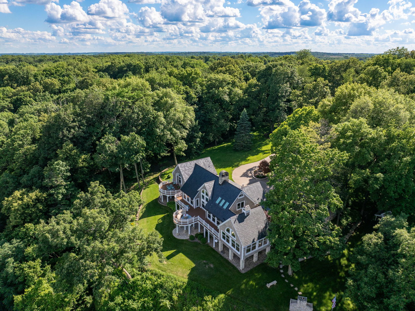 One of a kind estate with over 11 acres & stunning Mississippi River views! Custom built and meticulously maintained! Soaring ceilings, gorgeous views from every room. Primary bedroom with custom closet & attached full bathroom. Loft above with half bath. Main level laundry. The finished basement has a nice rec room, 2 additional bedrooms, sauna, craft room & ample storage! 2 car garage with finished apartment above. 2nd garage has additional loft space above. The second parcel has gorgeous walking trails, an additional deck for entertaining, and stunning views! Call listing agents for more information.