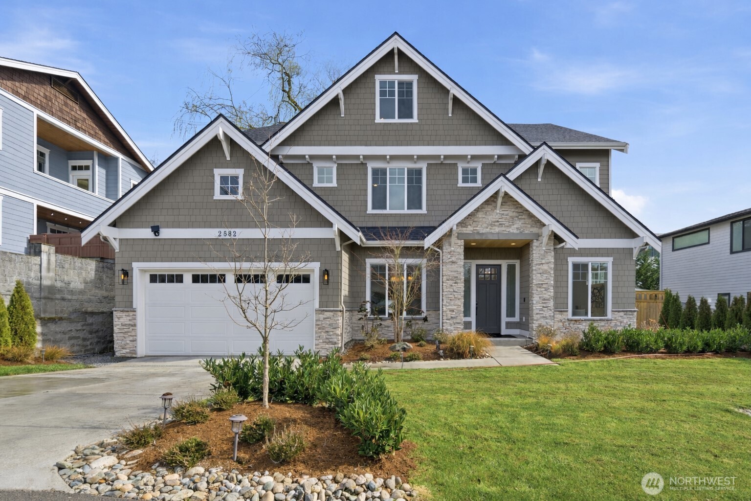 Experience refined luxury in this exceptional MN Custom Homes resale, where timeless Craftsman architecture meets sophisticated contemporary design. Perfectly positioned in the highly sought-after Woodridge neighborhood of Bellevue, this stunning home offers both elegance and everyday comfort. Step inside to a breathtaking two-story great room, where soaring ceilings and walls of windows flood the home with natural light. Chef’s kitchen features premium Wolf and Sub-Zero appliances, custom cabinetry, and an oversized island. A covered outdoor patio extends the living space, perfect for year-round relaxation and hosting.Upstairs, a spacious bonus room offers flexible space for media, recreation, or living. The thoughtful layout includes a main-floor guest en-suite, ideal for visitors or multi-generational living. The luxurious primary suite upstairs features vaulted ceilings and a spa-inspired bath with heated floors, creating a peaceful private retreat. Additional 3 bedrooms include a mini primary en-suite, offering comfort and privacy.Designed for modern lifestyles, the home also includes a dedicated work-from-home office and integrated smart home technology throughout.Located within top-rated Bellevue schools—Woodridge Elementary, Chinook Middle, and Bellevue High—and just minutes from DT Bellevue, I-90, Microsoft and the Spring District. Close to Creek Park and Bellevue Botanical Garden, this home offers the perfect balance of nature, convenience, and luxury living.