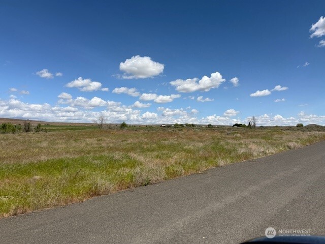 Level 19.88 acres in the City of Soap Lake. Division.4 NE bisects property.  Buyers responsibility to confirm and connect to all utilities