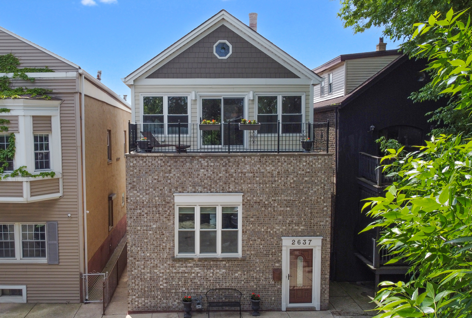 Welcome the perfect blend of historic charm and modern living in this thoughtfully expanded 2-bed, 2-bath home, originally built in 1890. With two seamless additions, the open-concept layout offers a surprising sense of space and flow rarely found in the city. The updated kitchen is ready for your next dinner party or weeknight unwind, with quartz countertops, stainless steel appliances, and smart storage solutions that make cooking and entertaining effortless. On the main floor, you'll also find a full bathroom with a sleek walk-in shower and a spacious bedroom with a wall of closets. Upstairs, the second floor is your private retreat in the trees- with vaulted ceilings, a wall of windows, and built-in storage that spans floor to ceiling. Step out onto your private terrace to sip coffee or catch a sunset. The fully updated en-suite bath features a large soaking tub, perfect for relaxing at the end of the day. The laundry room is conveniently tucked just outside the primary bedroom. The basement, with outdoor access, offers tons of bonus space for stashing seasonal gear. Out back, one of the largest paver patios in the neighborhood sets the stage for laid-back weekends and impromptu get-togethers. The built-in gas grill and above-ground heated pool with permanent equipment and a new liner make summer entertaining easy and fun. The yard is fully fenced with a 2 1/2 car garage, and easy alley access. All of this in a vibrant neighborhood close to transit, parks, and local favorites. This home brings together vintage character and everyday ease-it might be everything you're looking for! *Buyer has home-sale contingency - continuing to show*
