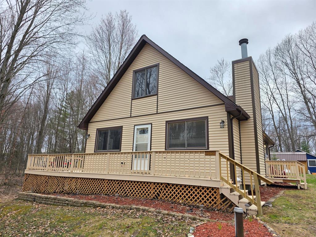 Your up north getaway is here! Beautiful 3 bedroom 2 bath lofted chalet has everything you're looking for! Built in 1993 and very well maintained, it sits on nearly an acre and includes a bonus vacant lot directly across the street with lake frontage on popular Doc and Tom Lake. Launch a kayak or small boat from your private lake access and enjoy the 323 acre all sports lake. Lake of the Pines is a neighborhood community located in Lake, Michigan between the towns of Farwell and Lake George. Inside the home is an open and inviting floor plan with fireplace, loft, and slider to wrap around deck and hot tub. Outside is a private yard, bonus storage shed and firepit area.This home is part of the "Lake of the Pines" community, which is a private hoa with ownership in all common areas including lake access, campground, community center, outdoor pool, and hundreds of acres of private hunting grounds! More association amenities include frisbee golf, horseshoes, basketball, beach volleyball, shared beach and playground, plus so much more! Even rent a slip for a larger boat on private pontoon island. Enjoy all the benefits of Lake Life while sitting next to a private campfire and listening to your babbling brook frontage. This property has too much to mention! https://www.simplelyfestays.com/lake-of-the-pines-cottage-hot-tub-orp5b6e536x