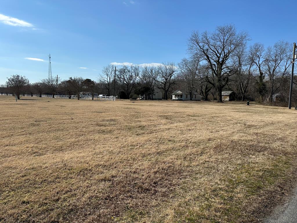 Located just outside the corporate limits of Cheriton in the desirable Bayview Community, this corner lot offers a rare mixed-use development opportunity. Mail service is provided through Cape Charles. Utilities are available, with water and sewer.. The approximately half-acre lot is zoned for both residential and commercial use and is designated for a shophouse-style duplex—featuring a two-bedroom residential unit upstairs with ground-level commercial space. Just 10 minutes from Cape Charles shops, restaurants, and beaches, and build-ready.