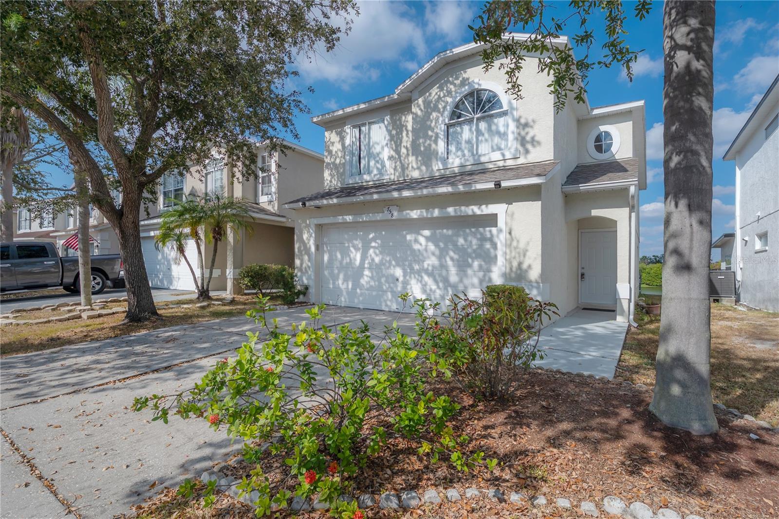 Welcome to your tranquil lakeside retreat in the inviting community of Heather Lakes. Whether you’re a first-time homebuyer searching for a place to make your own or an investor looking for a proven performer, this property checks every box—it has previously served as a successful rental, loved and well-maintained by its owners. Just a quick 20-minute drive from downtown Tampa, this home offers the perfect blend of peaceful suburban living and city convenience.Set on a private lot that backs onto the water—with no rear neighbors—you’ll enjoy mornings filled with golden sunlight reflecting off the lake and evenings spent unwinding in total privacy. Inside, the home welcomes you with an open, airy floor plan drenched in natural light and framed by elegant arched windows and timeless architectural archways. A spacious living room flows seamlessly into a large family room, creating an ideal layout for entertaining or cozy nights in. The kitchen features warm wood cabinetry, granite countertops, and plenty of prep space, perfectly combining style and function.Step into the 168 sq ft covered and screened Florida room, where you can sip your morning coffee, entertain friends, or simply take in the lake view year-round. Upstairs, the primary en suite serves as a peaceful retreat, with an arched window overlooking the lake, and a beautiful en suite with dual sink vanity and huge walk in closet. Also upstairs are three additional guest bedrooms that provide flexibility for family, guests, or a home office and a spacious guest bathroom. Each bathroom has been thoughtfully updated, ensuring a move-in-ready feel from day one.This home has been meticulously cared for and well maintained. It’s the perfect blank canvas—move in and enjoy it as is, or bring your own design vision to life with simple updates that reflect your style. Roof was replaced in 2020 and HVAC is newer.With an attached two-car garage, a private lakeside lot, and a location that puts you within minutes of major shopping, dining, and just 20 minutes from downtown Tampa, this Heather Lakes gem offers both lifestyle and opportunity—a home that works as beautifully for living as it does for investing. **RECENTLY APPRAISED AT $390,000** Inquire about preferred lender incentives with up to $5,000 toward buyer closing costs.