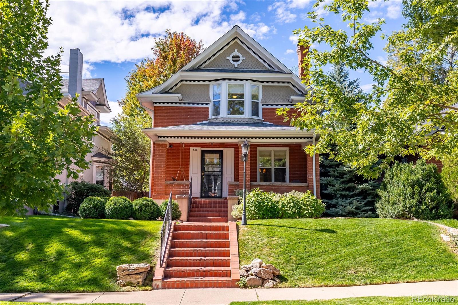 Built in 1913, this updated residence combines historic charm with modern upgrades throughout. Warm and inviting, the front porch opens into a welcoming foyer with a beautiful, classic staircase, a generous living room featuring a gas fireplace, as well as a spacious dining room with bay window. Rich in character with a fresh, modern style, the interior is filled with sunshine and accented by gorgeous hardwood floors, crown molding, high ceilings, plus a new powder room with designer wallpaper on the main level. The heart of the home is the great room, the perfect gathering place where hosting friends and family is a breeze. Open to a well-equipped kitchen, highlighted by attractive white cabinetry, stainless steel appliances, breakfast bar and adjacent breakfast area with built-in banquette seating. The mudroom offers a bench and built-in cabinetry, and leads outdoors to a delightful brick-pavered patio and private, treed backyard. Upstairs, the primary suite is a cozy retreat with a sky-lit vaulted ceiling, private balcony overlooking the yard, walk-in closet and new en suite bath with radiant floor heat. Two additional bedrooms are found on the second floor, each with a walk-in closet, plus a lovely full bath. Huge laundry room and ample storage are located on the lower level. Offering a rare chance to own a piece of Denver's vibrant culture within the East Seventh Avenue Historic District, this home is just minutes to nearby parks, Denver Botanic Gardens, Downtown, as well as the world-class dining and shopping of Cherry Creek.