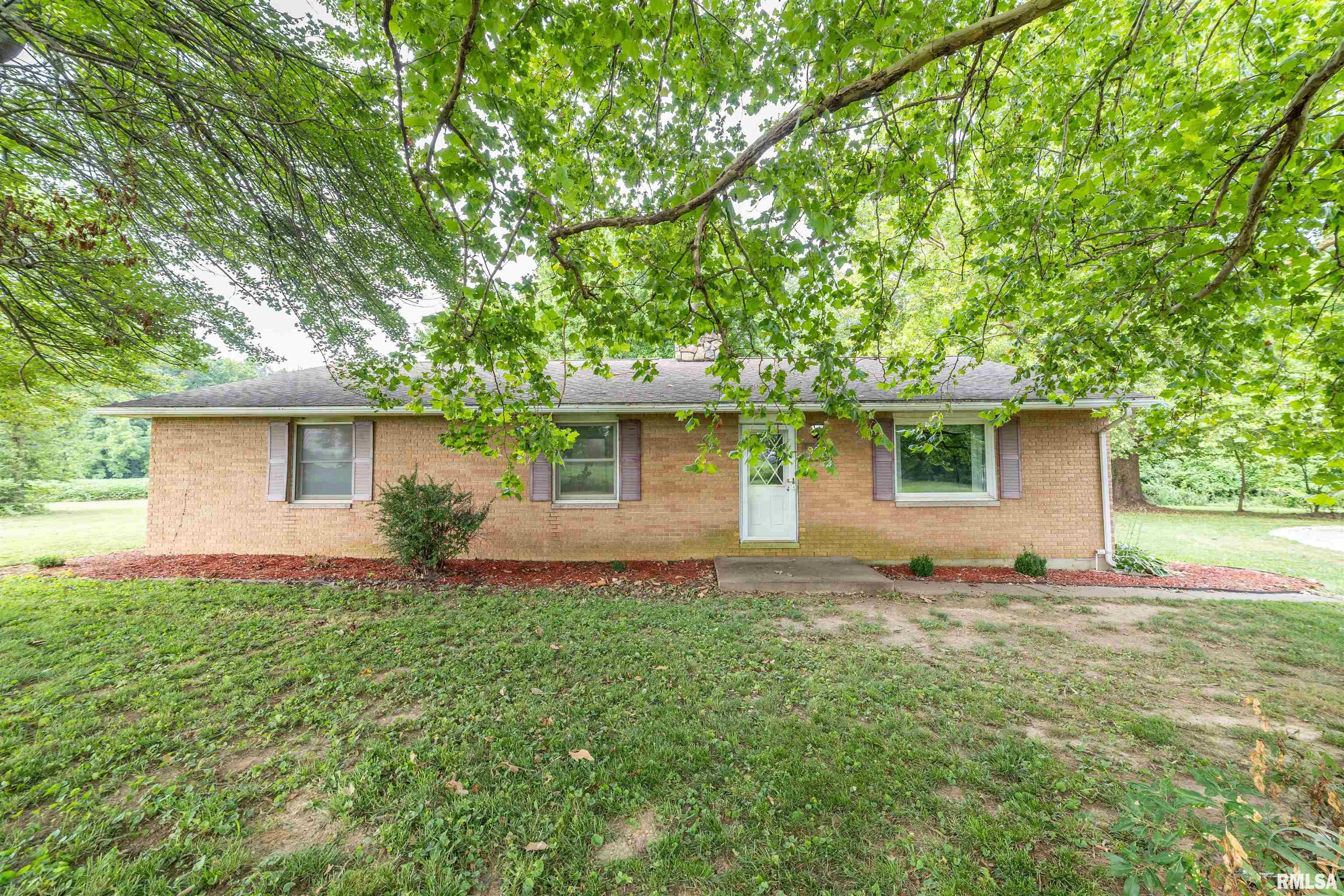 Enjoy the perfect combination of privacy, space, and convenience with this well-maintained 2-bedroom, 2-bath brick ranch situated on approximately 1 acre. Offering over 1,800 square feet of one-level living, this home features generously sized rooms designed for comfortable everyday living and entertaining. The inviting layout showcases a beautiful double-sided fireplace, adding warmth and character to multiple living spaces. The updated kitchen, spacious living areas, and thoughtful floor plan make this a wonderfully functional home. With many updates including the kitchen, bathrooms, flooring, water heater, windows, HVAC system, and roof, providing peace of mind for years to come. Outside, you'll appreciate the 2-car attached garage, private patio, and the tranquil setting with plenty of room to enjoy the outdoors while still being just minutes from town. If you're looking for quality construction, modern updates, and a peaceful location, this brick ranch is one you won't want to miss.