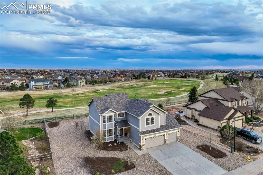 Evenings on the Deck. Fairway Views Beyond.Welcome to 10749 Greenbelt Drive in Meridian Ranch, a well-maintained 4-bedroom, 2.5-bath home backing to the golf course with peaceful views and a thoughtfully designed layout. The main level features newer interior paint, formal living and dining spaces, and a functional kitchen with granite tile countertops, cherry cabinetry, stainless appliances, and LVP flooring. A bright bay window dining nook adds charm and natural light. The adjoining family room with gas fireplace creates a warm gathering space, while a main-level office with French doors, mud room with built-ins, and half bath add everyday convenience. Upstairs offers three secondary bedrooms, a full bath with dual sinks, and a laundry closet. The primary suite includes vaulted ceilings, a 5-piece bath with separate vanity area, and a large walk-in closet. The unfinished basement, already plumbed for a future bath, provides room to grow. Enjoy the xeriscaped backyard and a beautiful cedar deck with pergola, perfect for relaxing and taking in the golf course setting. Additional updates include a new roof (2023) and new furnace (2025).  Life in Meridian Ranch is centered around outdoor living, with sunshine, fresh air, and panoramic views creating an active, connected lifestyle. Residents enjoy a 215-acre regional park featuring sports fields, trails, picnic pavilions, courts, and a dog park, along with eight neighborhood parks woven throughout the community for easy everyday access. With over 24 miles of scenic trails, there are endless opportunities for walking, biking, and enjoying the outdoors right outside your door.