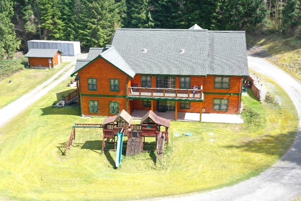{Custom Built Show Stopper on 10 acres in Arlington} This home has nearly 6000 internal square feet w/customizations throughout. Offering 5 bedrooms, 3.5 bathrooms, 2 offices, a workshop, geo thermal room, spa/wellness room  & a gym, this home has it all! The large primary has 2 walk in closets w/an ensuite & attached bonus room. The Chef's Kitchen is thoughtfully designed w/a double oven, granite countertops, plenty of storage & high end appliances (all appliances convey). Adorned w/engineered hardwood Radiant Heated Flooring & White Cedar Accents throughout, home is warm & inviting. Open concept floor plan w/Central Vacuum System throughout. Lower level could be converted for multi-generational living. The large upper deck offers the perfect space for relaxing & enjoying the expansive views or enjoy the large covered porch. With an attached garage & massive carport, covered parking is plentiful. Home has a unique Cedar Sing Log Siding System that was recently restored & is absolutely stunning. Equipped w/highly efficient Geo Thermal Heating System. No HOA. Outbuildings & plenty of space for a Shop, RV parking, gardening, or other. Buyer(s) to verify all information to their satisfaction. Home is located at the end of the road & surrounded by nature, offering privacy & tranquility while home offers comfort & luxury. Country living at its' finest. This house will feel like a "home" the moment you step through the door. Come see it for yourself, the opportunities are endless.