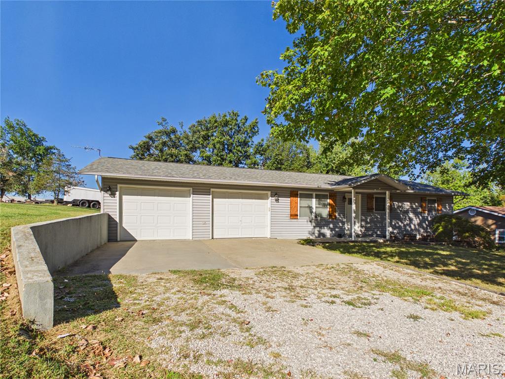 Welcome to your own private retreat! This beautifully situated 3-bedroom, 2-bathroom home offers the peace and privacy of a dead-end street while remaining just minutes from town. Featuring a 2-car attached garage and a newer 30-year shingle roof installed within the last two years, this home offers both convenience and peace of mind. The kitchen is sure to impress with high-end appliances, including a KitchenAid oven, Bosch dishwasher, and a newer Samsung Family Hub refrigerator featuring its signature writable display, perfect for keeping track of your calendar, leaving notes, sharing messages, and adding a little fun to everyday life. These quality appliances bring a touch of luxury and modern convenience to the heart of the home. Enjoy the best of both worlds with a private setting just outside of town while remaining only minutes from shopping, dining, schools, the interstate for commuters, and everyday conveniences. A wonderful opportunity for those looking for a comfortable home in a peaceful location without sacrificing accessibility!