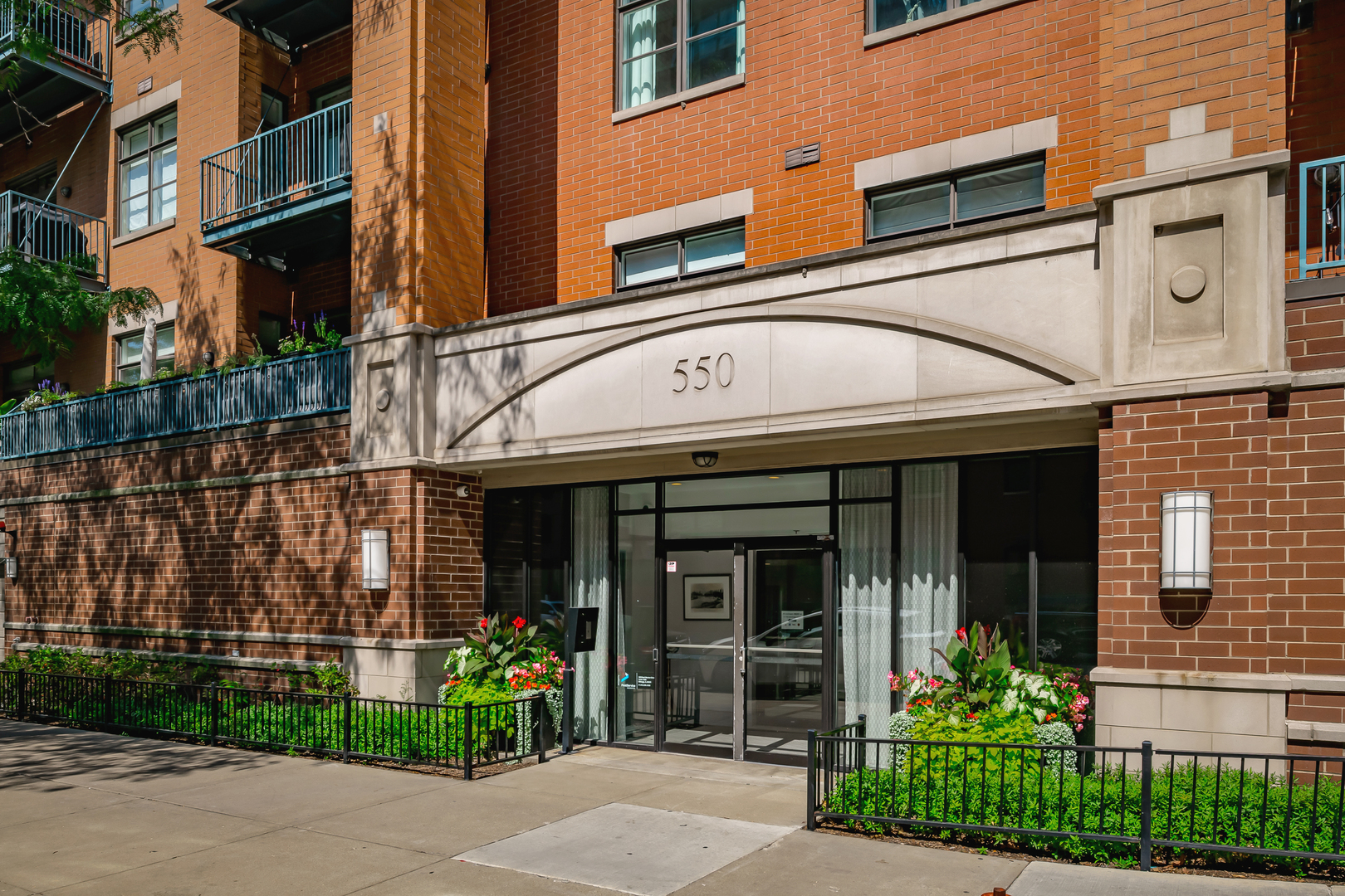 Fulton Market Living at Its Best! If you're looking for space, light, and comfort in a 2bd/2ba home, this spacious residence checks every box! Oversized windows flood the open layout with natural light, highlighting hardwood floors, tall ceilings, space for a full dining table and a cozy living room with fireplace and wired for surround sound making it perfect for both entertaining and relaxing.    The chef's kitchen impresses with 42" cabinets, granite countertops, a functional breakfast bar island, glass tile backsplash, and stainless steel appliances. The king-sized primary suite is a private retreat, complete with multiple closets including a walk-in and a luxurious en suite bath featuring dual vanity, soaking tub, and a separate stone shower. The spacious guest bedroom easily fits a queen bed, while the second full bath is conveniently accessible.  Step out onto the private balcony, accessible from both the living room and primary suite, for your morning coffee or evening unwind. Additional perks include in-unit laundry, large storage closet and garage parking.    Located just steps from the park, METRA, highways, and Jewel, and surrounded by some of Chicago's world-renowned dining experiences, this home truly has it all!