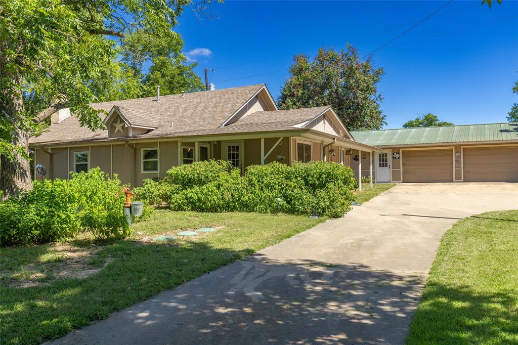 Nestled on nearly 14 peaceful acres, this beautifully maintained 2-bedroom, 1-bathroom home offers the perfect blend of comfort, functionality, and wide-open space. With a layout designed for both everyday living and weekend retreats, the home reflects true pride of ownership—thoughtfully updated, well cared for, and move-in ready. From the bright interior and energy efficiency to the charming finishes and solid structure, every detail speaks to quality and care.
Step outside into your own ranch-ready setup: fenced and cross-fenced with pipe, chain-link, and barbed wire, the property includes multiple pipe pens, sheds, a Priefert head gate, chute, and numerous cut gates for smooth cattle handling. An improved pasture supports hay production, adding even more versatility and value. There’s a feed room with concrete flooring and electricity, storage room, hay barn with metal roofing, city water at the barn, and an auto horse waterer that requires no electric hookup.

For hobbyists or weekend warriors, enjoy the AC-cooled man cave with built-ins, a garage with a 220 outlet and outdoor electric, and a covered patio with ceiling fan, built-in BBQ grill, and multiple water hookups throughout the grounds. The cement driveway, roll-up storage room, vapor light, and abundance of added features make country living comfortable and incredibly functional.

This property has been set up for long-term enjoyment, and it shows—whether you’re looking to run cattle, keep horses, harvest hay, or simply unwind beneath big Texas skies, this property delivers space, versatility, and peace of mind. 

*See Private Remarks & Transaction Desk for list of improvements*