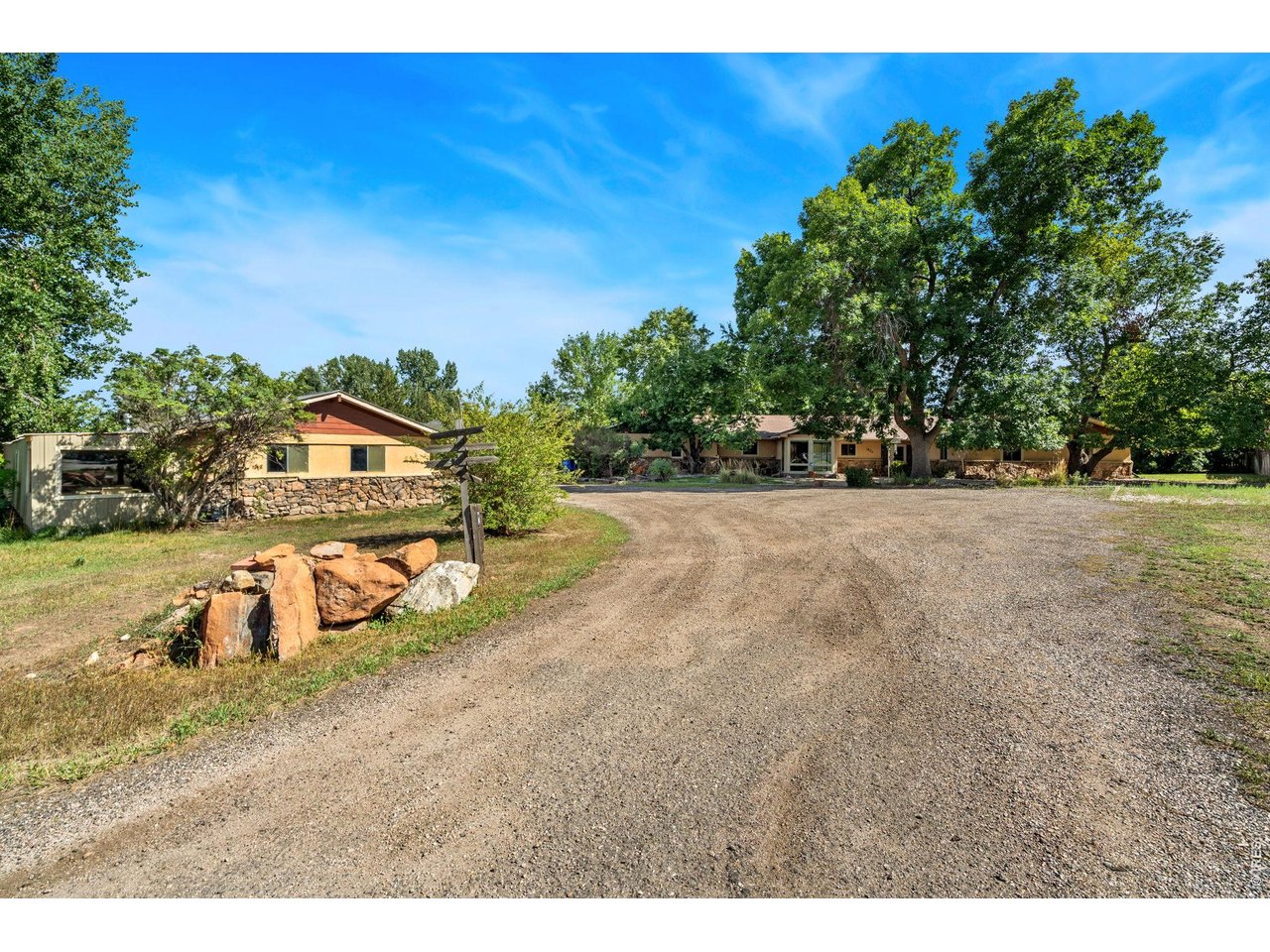 Here's your opportunity to own acreage in central FTC. This spacious ranch-style home is ready for your vision and offers endless possibilities. The main home features 5 bdrms and 2.5 baths, plus an attached apt ideal for a family member, guest suite, or rental income. Enjoy a cozy family room with a wood-burning fireplace and a large living room that could easily serve as a flex space. The out-bldg, with 2 parking spaces, offers excellent potential for a shop, horse stalls, etc. plenty of room for animals, gardens, and more, this property is ready to make your vision a reality! Access to biking and walking trails - next to the Red Fox open space.
