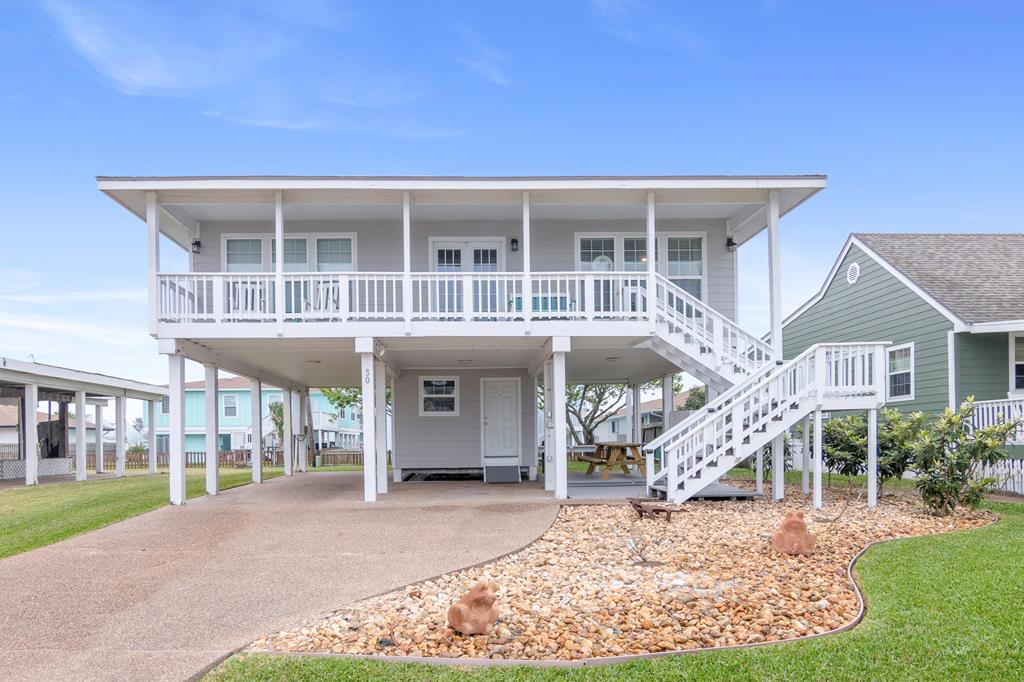 Welcome to your perfect island getaway! This lovely Key Allegro home offers 2 bedrooms/2 bathrooms and an open concept design with coastal charm throughout.  Enjoy the breezy front and back decks, perfect for morning coffee or evening relaxation.  Situated on a nice-sized lot, this home features entertainment space underneath, complete with storage-ideal for gatherings, cookouts, or simply unwinding after a day on the water.  Upgrades include stainless steel appliances, quartz countertops, wood look plank flooring, and stylish shiplap accents.  Sold fully furnished, this home is move-in or rental-ready.  Enjoy the beautiful community pool on those fun summer days!  Get ready to hop in your golf cart and experience all that Key Allegro has to offer!