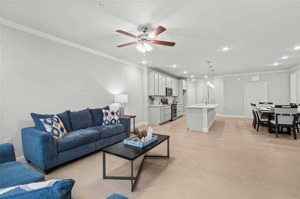 This spacious 3-bedroom Sherwood floor plan features a private garage conveniently attached to the building, offering both comfort and security, plus additional covered parking. Located on the third floor of The Gatherings—the only 55+ active adult condo community in Allen—this home blends modern convenience with a welcoming, connected lifestyle. Lightly lived in for just a few months, the home showcases beautiful wood floors, premium upgrades, and an open layout ideal for everyday living or entertaining. 

The kitchen includes stainless steel appliances, generous counter space, abundant cabinetry, and a large walk-in pantry. A spacious laundry room, prepped for a utility sink, adds even more storage and flexibility. Each building includes an elevator and inviting lobby areas that provide additional gathering spaces to connect with neighbors. The living area opens to a covered patio, perfect for morning coffee or a peaceful evening outdoors. The third bedroom provides flexibility for a home office, craft room, or guest space. 

Designed for easy, low-maintenance living—no need to worry about exterior maintenance—residents can enjoy more time experiencing the community’s amenities and activities rather than focusing on upkeep. The Gatherings at Twin Creeks offers a warm, social environment where neighbors quickly become friends. Amenities include a resort-style pool, pickleball courts, fitness center, clubhouse, putting green, outdoor grilling area, community garden boxes, fire pit, dog park, and valet trash service. Homeowner-organized clubs and events—such as happy hours, game nights, and walking groups—make it easy to stay active and connected. The community also offers direct access to the Allen Trail System and is located near the Allen Events Center, Allen Premium Outlets, Twin Creeks Village, and The Golf Club, with easy access to major highways, shopping, and dining.