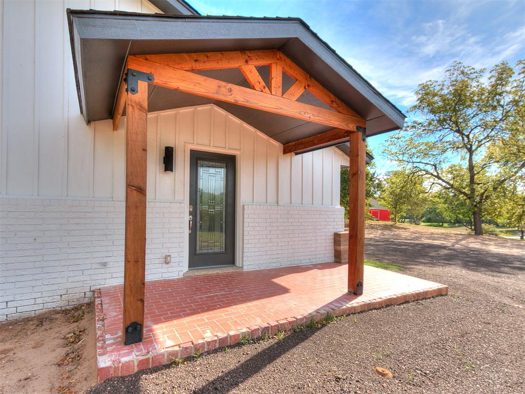 Welcome to 4311 SE 37th St, Norman, OK 73072, a charming single-family residence originally constructed in 1977. This beautiful home has been remodeled.  As you enter the home upstairs, you'll find a great foyer, with the living room and kitchen just beyond.  The kitchen has granite countertops.  There are two dining rooms. The living room has a double-sided fireplace.  Downstairs, there are two bedrooms, a full bath, an exterior door, and a fireplace.  Plantation shutters throughout the home.  The bathrooms have walk-in showers.  This home sits on 2.56 acres and is located in a quiet neighborhood. You have a circular drive with so much space to park.