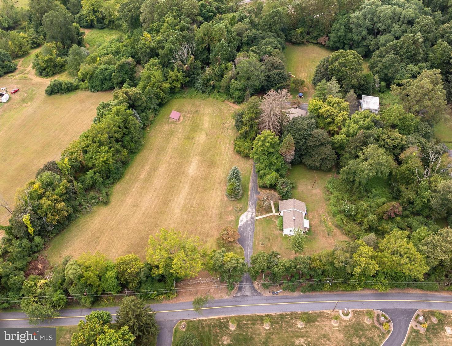Tranquil Country Estate w/ peaceful privacy - very RARE to find a property like this - marvelous sunset views, just minutes to towns of Paoli & Phoenixville, & you can  look 360 degrees & only see your property! You can finally get what you've been looking for- whether it's a family compound, organic gardens, room to run or have horses, play sports, build the dream house you have plans for, or just relax  & watch the sunset in peace & !  3 Dwellings on 7.2 Acres- Main House: 4 BRs, 2 Bths, Caretaker's Cottage: 2 BRs, 1 Bth, & Studio/ Apartment above oversized Garage has 1 BR & 1 Bath.   "Diamond Meadows"  has a stone wall fronting the quiet part of Diamond Rock - near Clothier Springs & Horshoetrail Trail.  Driving past the stone wall onto the property takes your breath away w/ amazing panoramic views.  Across from the front meadow  is a Charming Cottage w/ 1 floor living: Family Rm, 2 BRs, 1 full Bath w/ skylight, Laundry Rm, Kitchen open to DR w/ picture window, & full bsmt.  Next up the drive is Main House w/ a Great Rm that's width of building, & has a sunset view & superb light from 3 walls of windows, w/ 4th wall having a section of stone where there was a wood stove.   Good flow continues to a sunny Dining Rm. at back of big Foyer, Eat in Kitchen w/ Butler's Pantry & door to back yard.  There's a full Bath w/tub, & big Laundry/5th Bedroom.   Upstairs are  4 large Bedrooms & full Bath, all w/ good sized closets,   At the end of the driveway is an oversized Garage w/ big Laundry/ Storage Rm on main floor & upstairs there's a sunny  Apartment that would be  perfect for an Artist's  Studio-  as there's lots of light from many windows - even a big picture window in the Bedroom.  Studio Floorplan has Kitchen open to Family Rm.  & Dining area.   Subdivision started - may be able to have 3 existing dwellings on 1 LOT, & potentially 2 more building  LOTS- that can fit larger homes, pools, & barns- like across Diamond Rock!   This canvas is ready for your ideas - family compound,  farmette w/ animals, fields of flowers or holisitic/ organic self sustaining gardening - maybe start a farmstand!  Very desirable location has quiet privacy in the country, but lets you get everywhere quickly.  Back in 1920, this homestead was started by the Woodward family, who owned a Hat Shoppe in Phila.  Calm in the country- yet mins. to the R5 train in Paoli!  Seller has started engineering work for potential subdivision-  See attached Plot Plans in documents.   Excellent location close to the Main Line, Paoli Hospital & Train,  Hip & Happening Phoenixville,  the turnpike, Rts. 202 & 422.  Valley Forge Park is around the corner, w/ miles of trails to hike, bike, fish, & ride horses.  Valley Forge Swim Club on the Mountain has racquet & B-Ball courts & the Pool is perfect for the dog days of Summer & meeting your friendly new neighbors!! Improvements inc: new septic system for Main House & Garage / Studio, new roofs, & new heater in Main House- so you could move right in & create the Home of your dreams!  The main homesite was probably chosen in 1920 for its fabulous southern exposure & the existing home has great flow, spacious rooms, & wonderful views from every window!  Main house is in good shape and waiting for your personal touches  - maybe add a MBR over the Great Room?  "LOTS" of possibilities - Property under contract w/ builder to take thru subdivision. Call Missy w/ any questions
