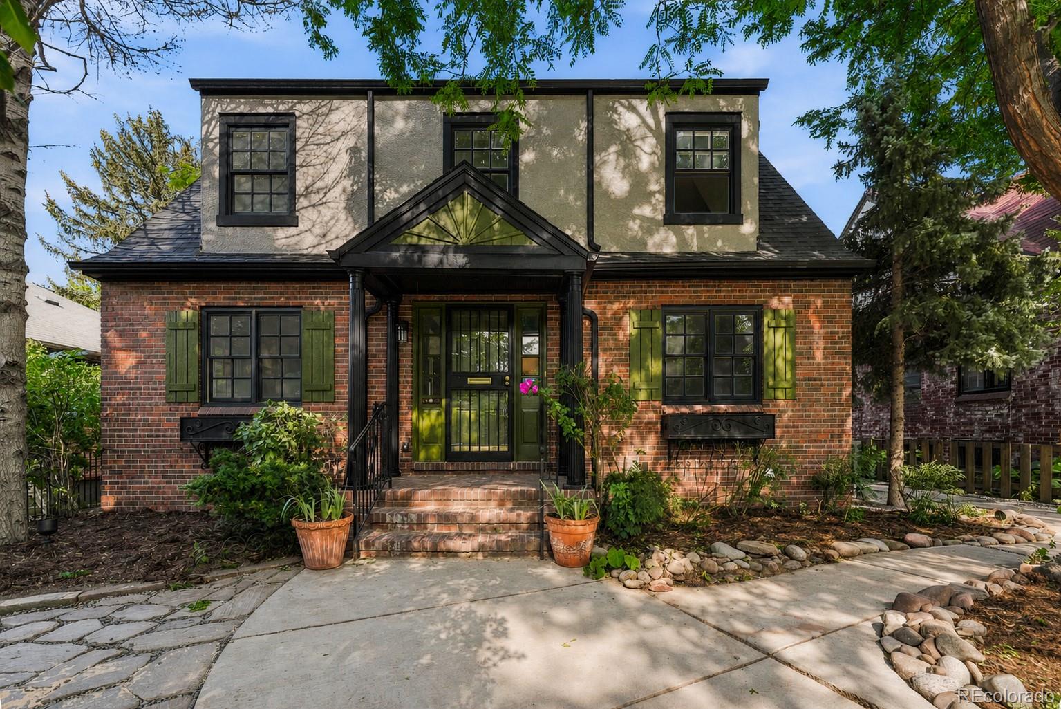 Prepare to fall in love with this extraordinary Denver home, where timeless architecture and modern luxury come together in spectacular fashion. Fully permitted and meticulously renovated, this home lives as beautifully as it looks. Natural light pours into the generous living room, where a stunning fireplace creates an inviting focal point for cozy evenings and effortless entertaining. The elegant dining room flows seamlessly into the heart of the home—a magazine-worthy chef's kitchen designed to impress. Outfitted with a GE Café Suite appliance package, gas range, quartz countertops, designer backsplash, premium fixtures, pantry with pull-out shelving, coffee bar, and an oversized peninsula with seating for four. A private office tucked behind French doors opens directly to the covered Trex deck and an incredible backyard oasis. Rarely found in the city, this lush, expansive retreat offers exceptional privacy, mature landscaping, and plenty of room to dine, entertain, garden, or simply unwind beneath the trees. Upstairs, the luxurious primary suite is your own private sanctuary, complete with a spacious walk-in closet, private balcony with peaceful treetop views, and a spa-inspired five-piece bath featuring dual vanities, a deep soaking tub, private water closet, and a breathtaking glass-enclosed shower with rainfall and handheld fixtures. Two charming secondary bedrooms and a beautifully finished hall bath with dual vanities complete the upper level. The finished basement is equally impressive, offering an expansive media and recreation room, a generous guest suite with an egress window, another beautifully designed bathroom, and a spacious laundry room with exceptional storage. Perfectly situated on one of Central Denver's most desirable blocks, you'll enjoy an unmatched lifestyle just moments from Snooze, Postino, Trader Joe's, the AMC Theatre, and neighborhood parks. Sophisticated, stylish, and impossible to forget, this is the one you've been waiting for.