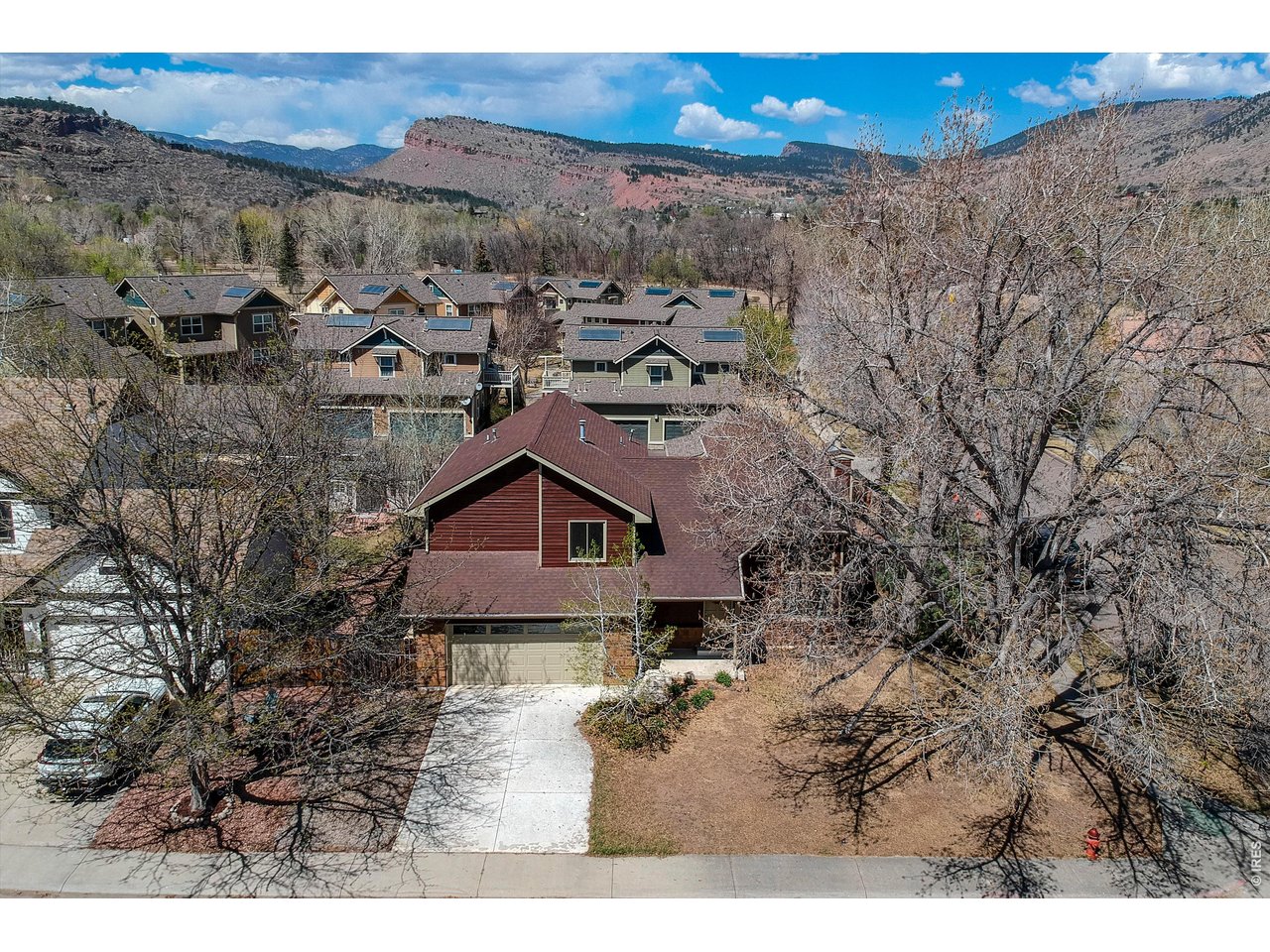 Crisp & clean 4 bedroom home in Lyons Valley Park ready for you! Perfectly located on a corner lot and offering views of the beautiful foothills all around. Enter into the living room w/ soaring ceilings, wonderful light and wood-burning fireplace. Perfect home office setup w/ study featuring built-ins & access to the backyard. Two dining spaces - a formal DR & a breakfast nook in the kitchen w/ eating bar. Upper has 4 beds, including primary suite w/ private bath. Cat walk to a large secondary bedrooms w/ more views. Freshly stained & painted exterior, new interior carpet & paint too! Relax on the large rear deck, freshly stained as well. Furnace 2024. No HOA. Come live the Lyons lifestyle, where countless outdoor activities are right outside your doorstep. Walk, bike or golf cart to downtown w/ coffee shops, restaurants & live music. Bohn Park is just down the street. Miles of Open Space trails to explore too!