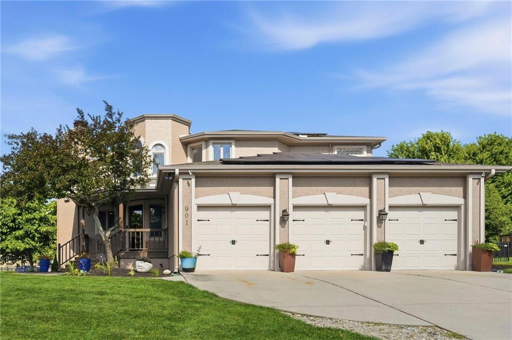 Pre-inspected 4-bedroom, 3.5-bath home in Raintree Lake offering approximately 2,900 SF above grade plus 1,120 SF of finished basement space, including a non-conforming bedroom. Positioned on a fenced corner lot with lake views and located within the highly regarded Lee's Summit School District, this home combines recent updates, energy efficiency, and access to the exceptional amenities of Raintree Lake.The main level features hardwood flooring, abundant natural light, multiple living and gathering spaces, a fireplace, and a kitchen with extensive storage. Skylights enhance natural light throughout the home, while the finished basement provides exceptional flexibility with a spacious recreation area, non-conforming bedroom, and additional space ideal for a home office, fitness room, hobbies, or media. The primary suite features a private balcony with lake views.Outdoor spaces include a covered front porch, updated deck flooring and railing, a fenced backyard, mature landscaping, and plenty of room for entertaining or relaxing. The oversized 3-car garage offers additional storage.Major improvements include solar panels (2021), HVAC system (2022), tankless water heater (2022), skylights (2026), roof repair and new gutters (2026), new exterior paint (2026), new interior paint in secondary bedrooms (2026), bedroom carpet (2026), patio door replacement (2026), deck improvements (2026), front porch repairs (2026), and landscaping enhancements (2026). The solar system will be paid off at closing, allowing buyer ownership free and clear. Seller reports average electric costs of approximately $77 per month since October 2023.Enjoy the Raintree Lake lifestyle with year-round recreation, beautiful scenery, and convenient access to shopping, dining, parks, grocery stores, and commuter routes.